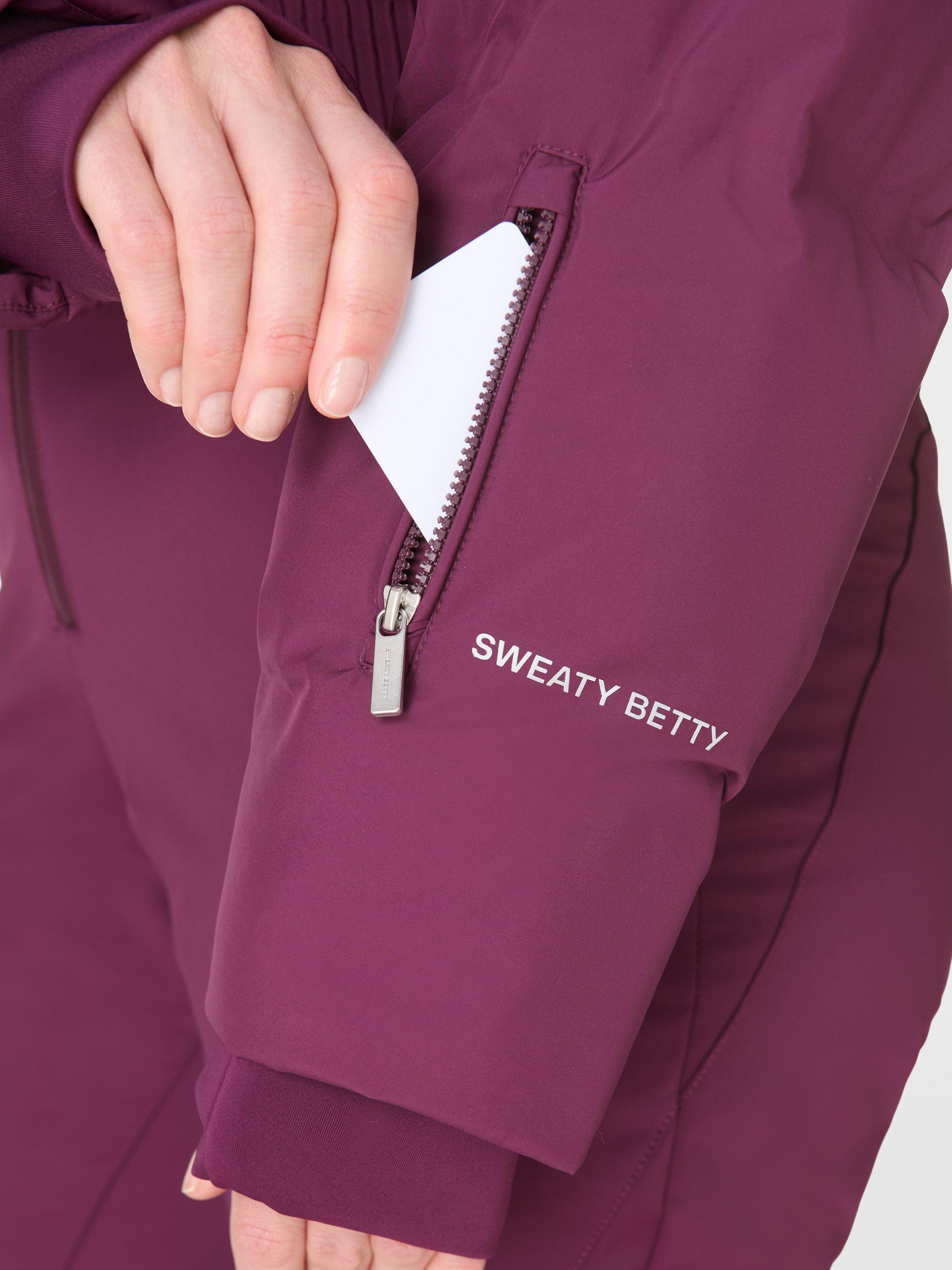 Product image 6 of 9, which shows Sweaty Betty Cropped Waterproof Ski Jacket, Plum Purple, XXS