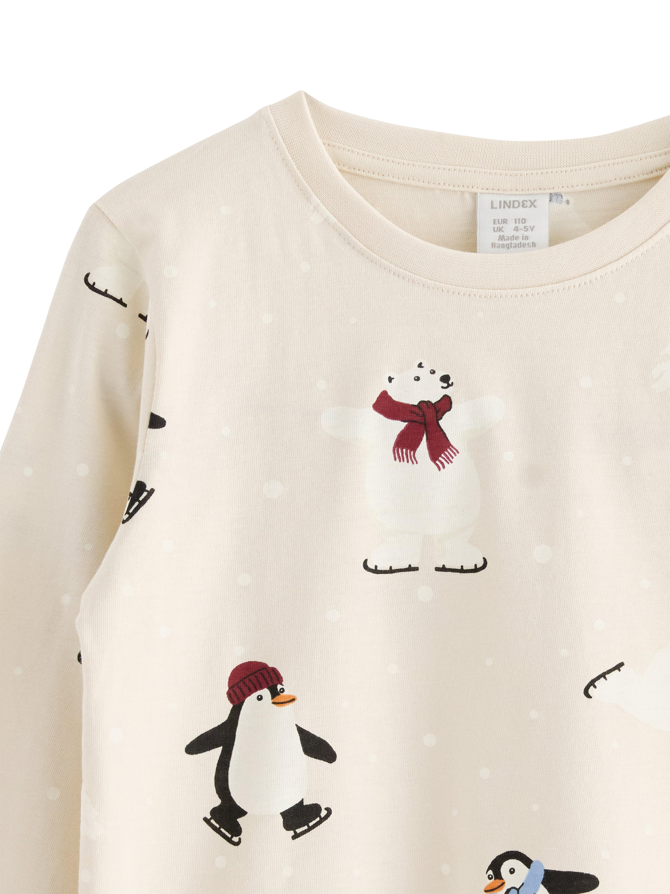 Product image 3 of 3, which shows Lindex Kids' Skating Penguins Jersey Top, Light Beige, 6-7 years