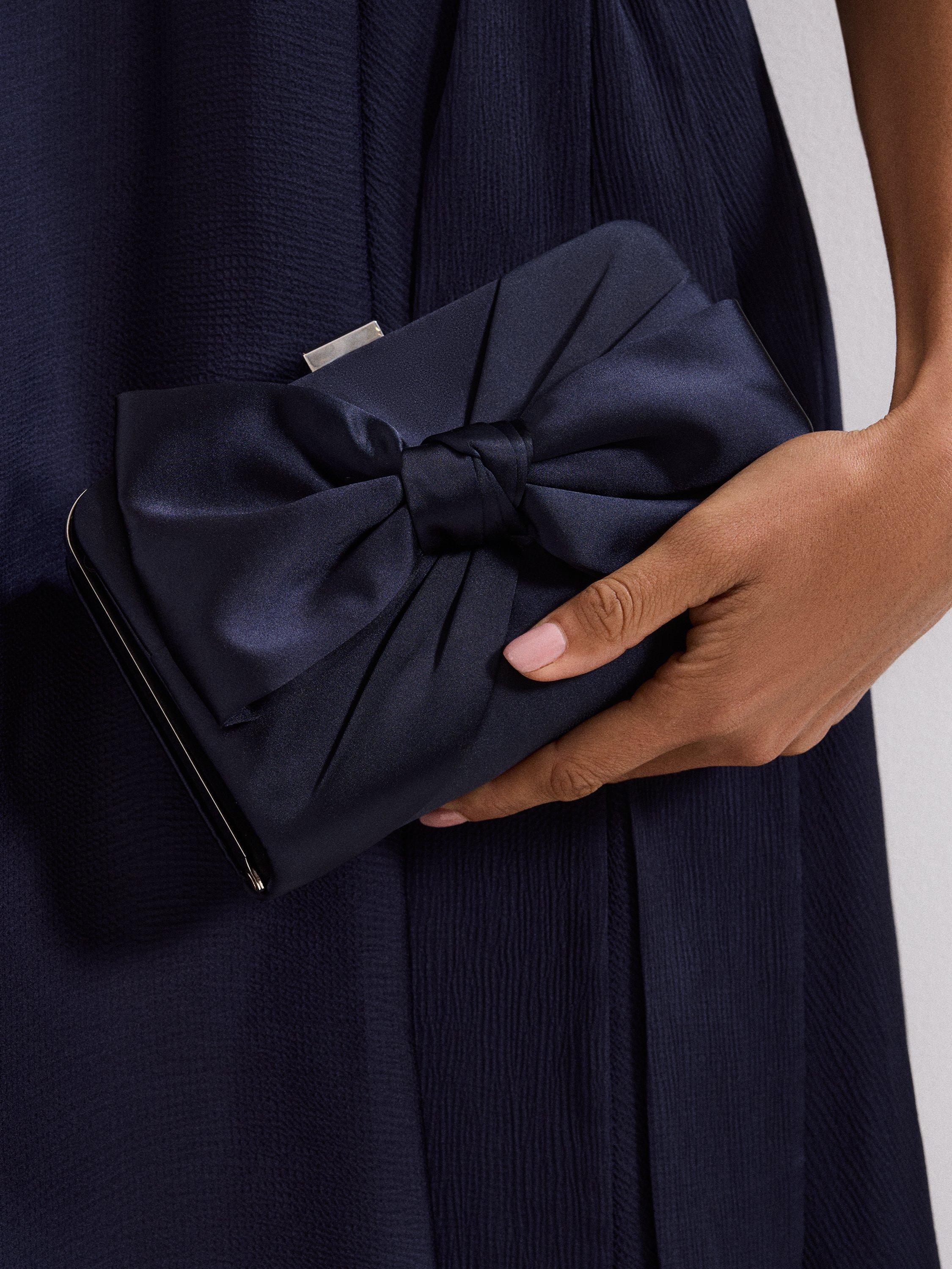 Product image 7 of 8, which shows Phase Eight Satin Knot Front Box Clutch Bag, Navy, Blue