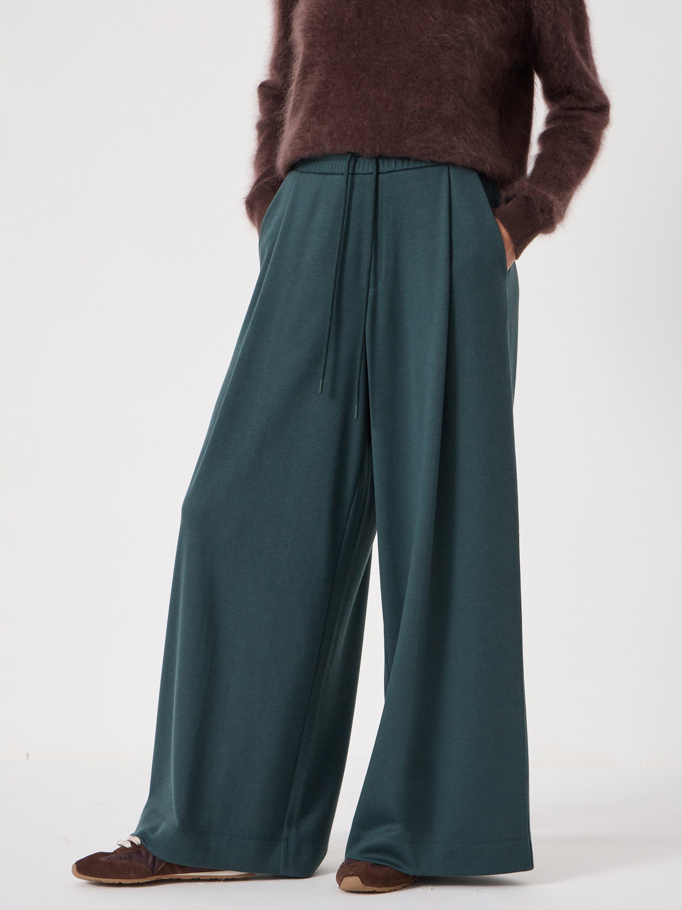 Product image 1 of 6, which shows HUSH Taylor Wide Leg Trousers, Teal Green, XS-S