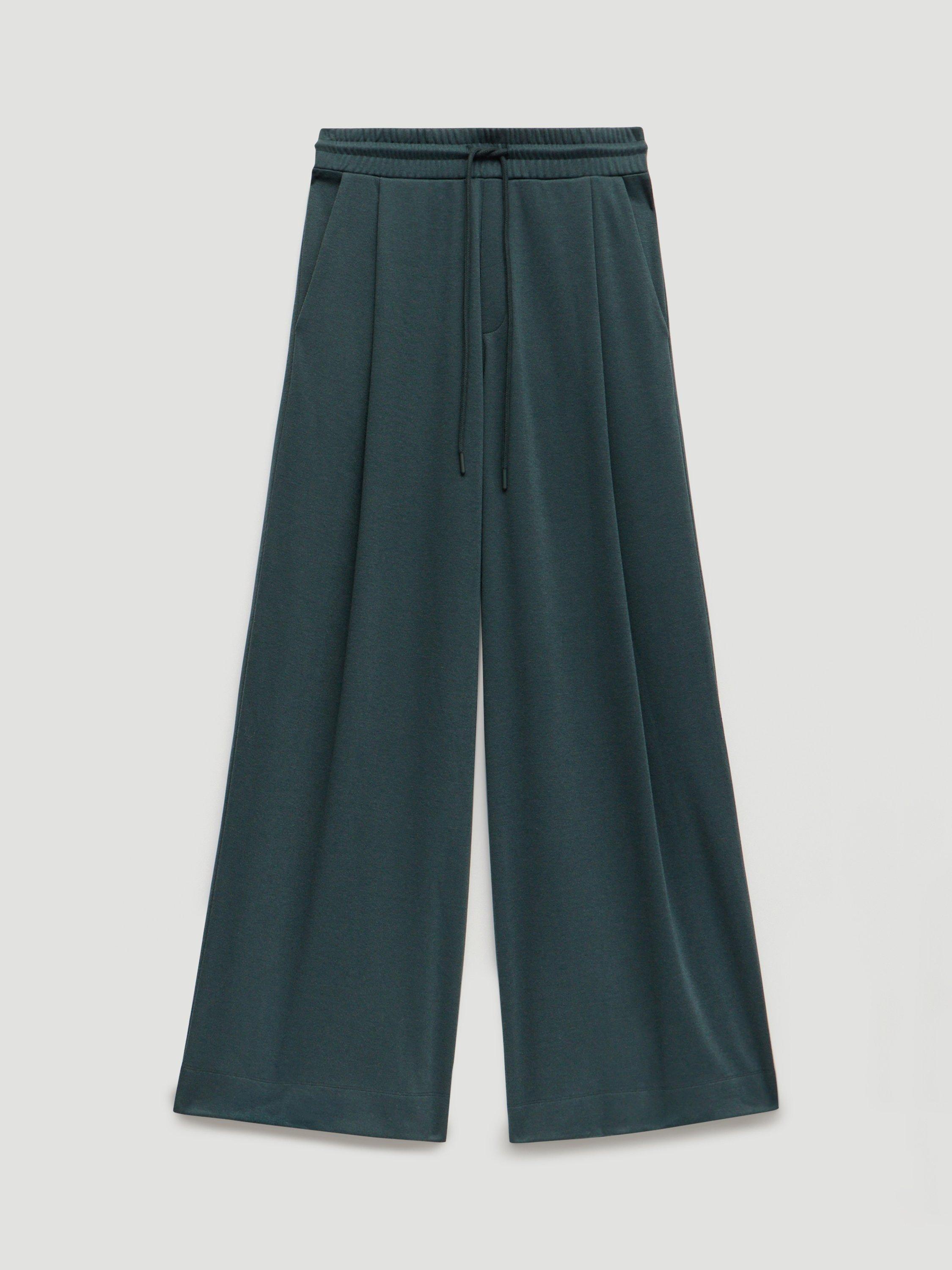 Product image 4 of 6, which shows HUSH Taylor Wide Leg Trousers, Teal Green, XS-S