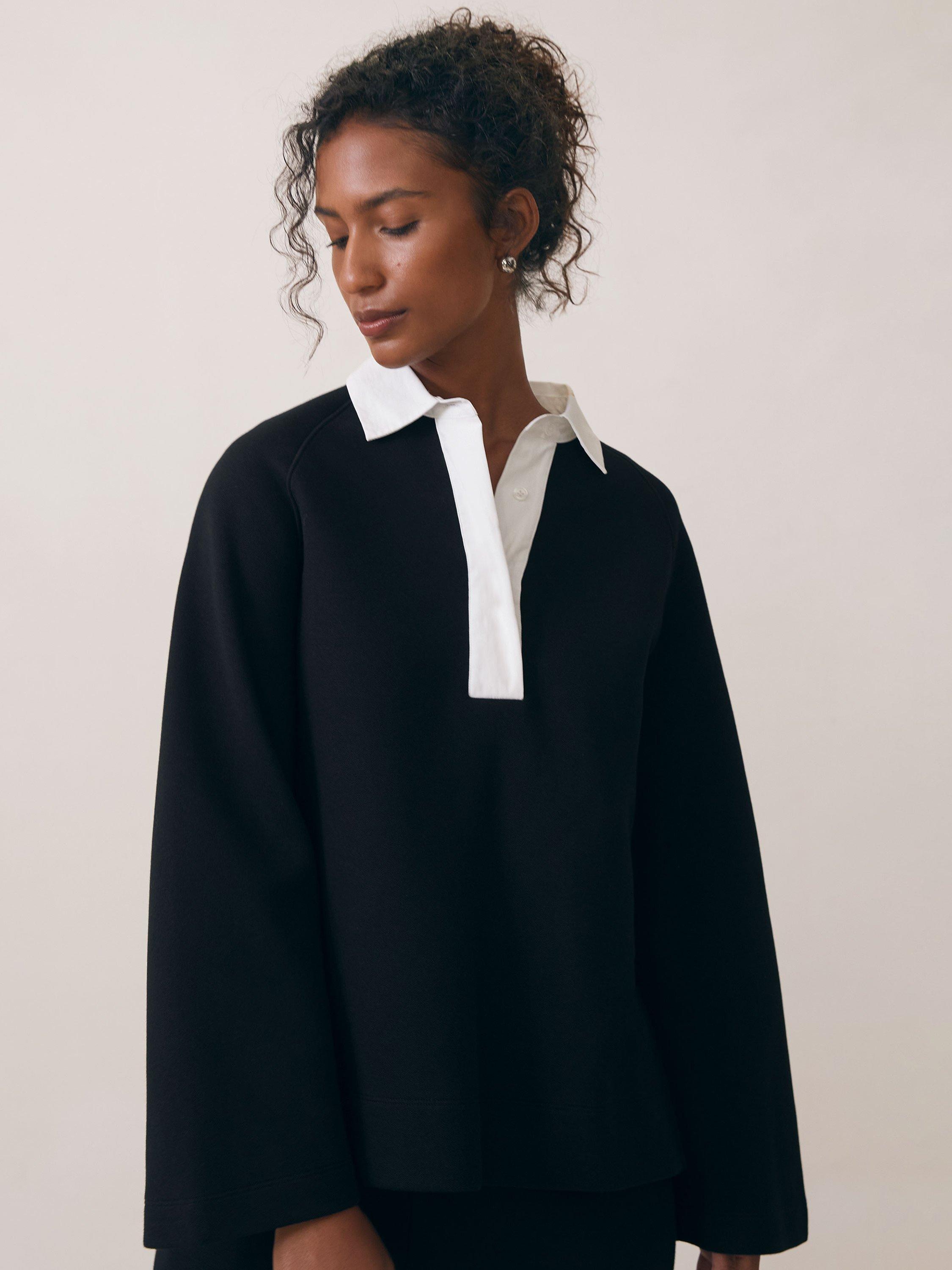 Product image 2 of 5, which shows Reiss Gaia Interlock Contrast Collar Jersey Top, Black/White, XS