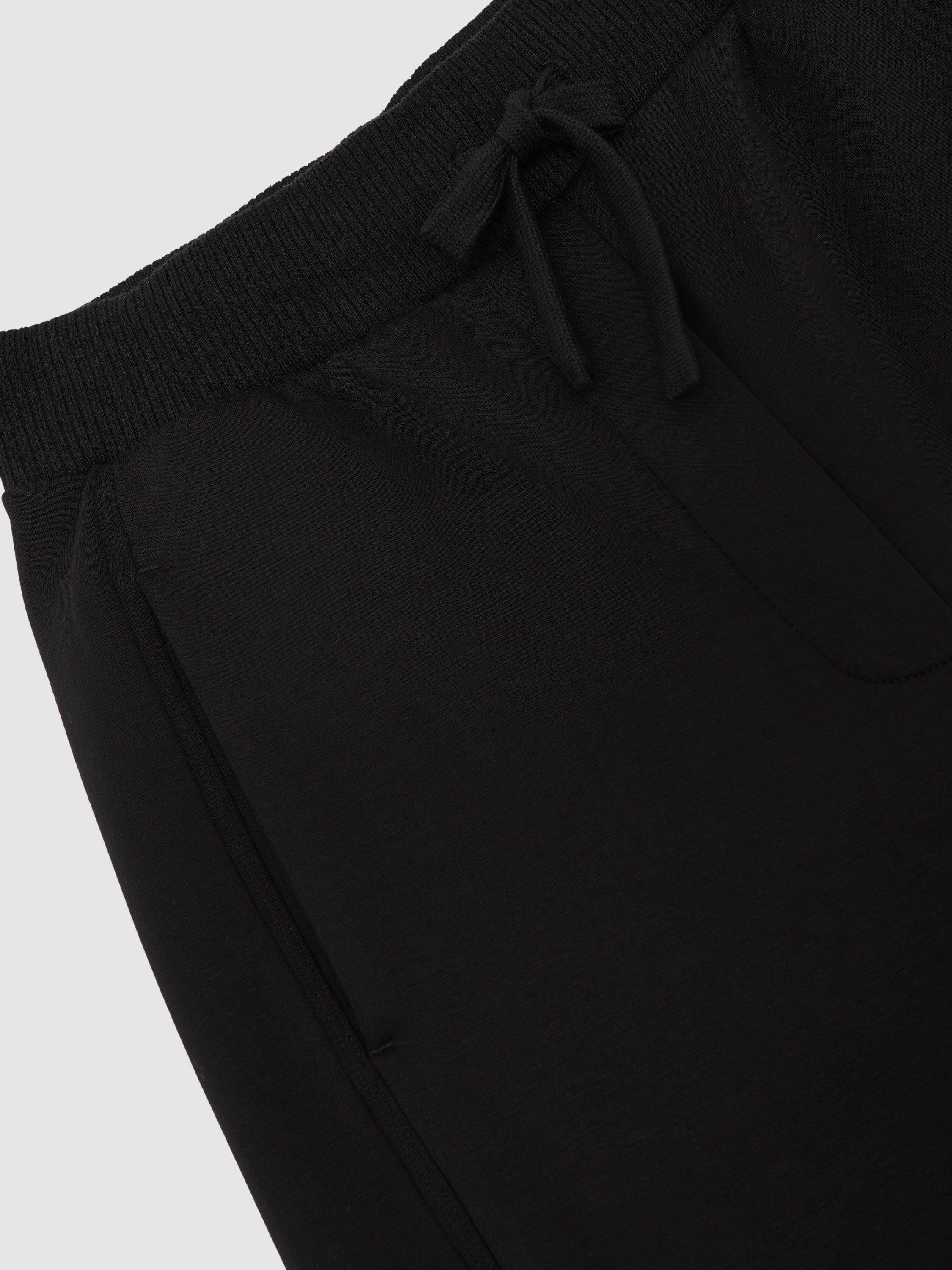 Product image 2 of 5, which shows Reiss Jemma Modal Blend Interlock Wide Leg Joggers, Black, L