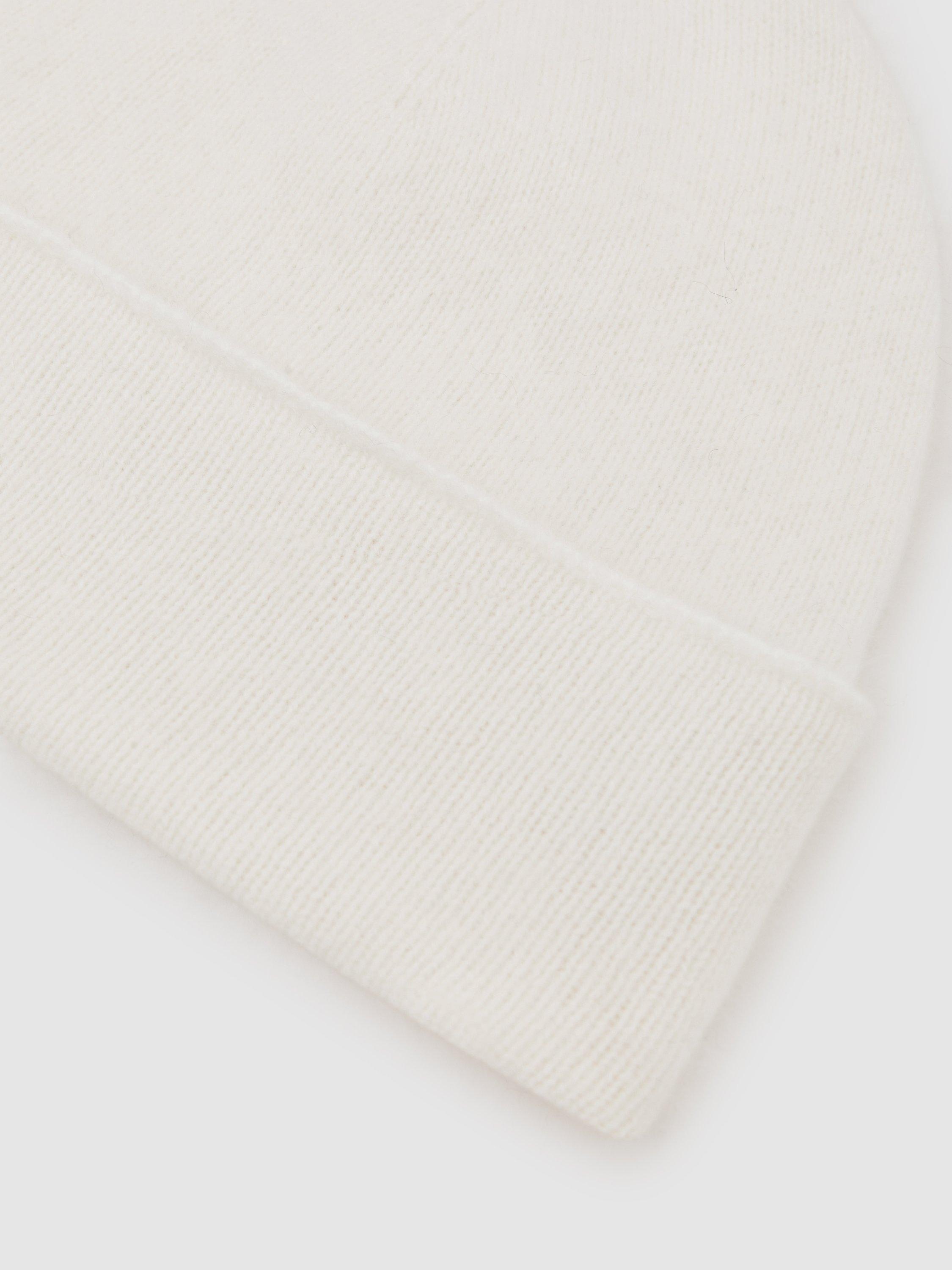 Product image 2 of 5, which shows Reiss Alba Pure Cashmere Beanie Hat, Cream, One Size