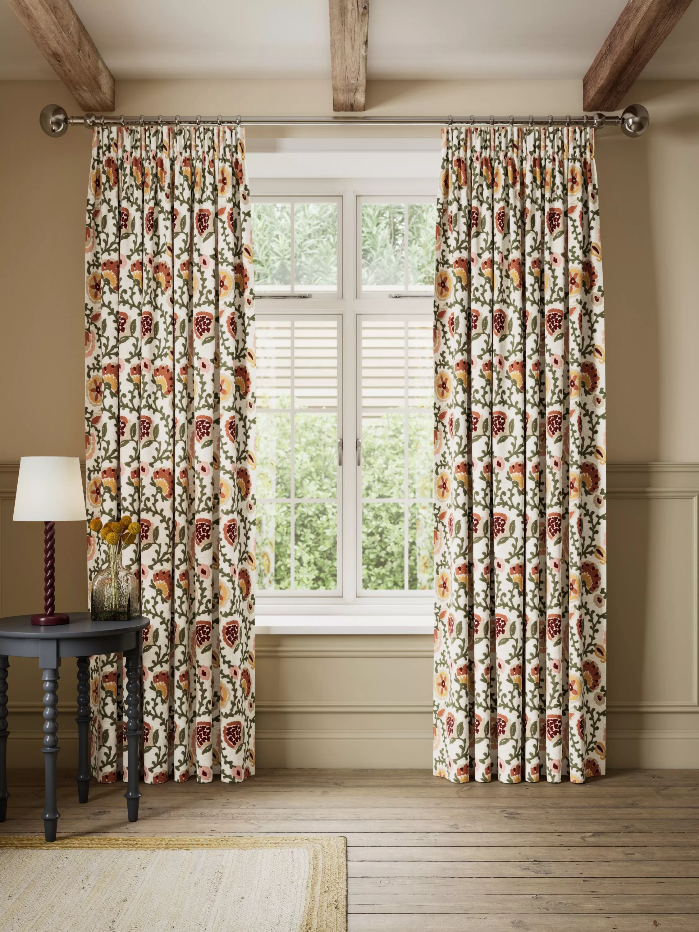 Beige floor length curtains on a patio door in a dining room setting 