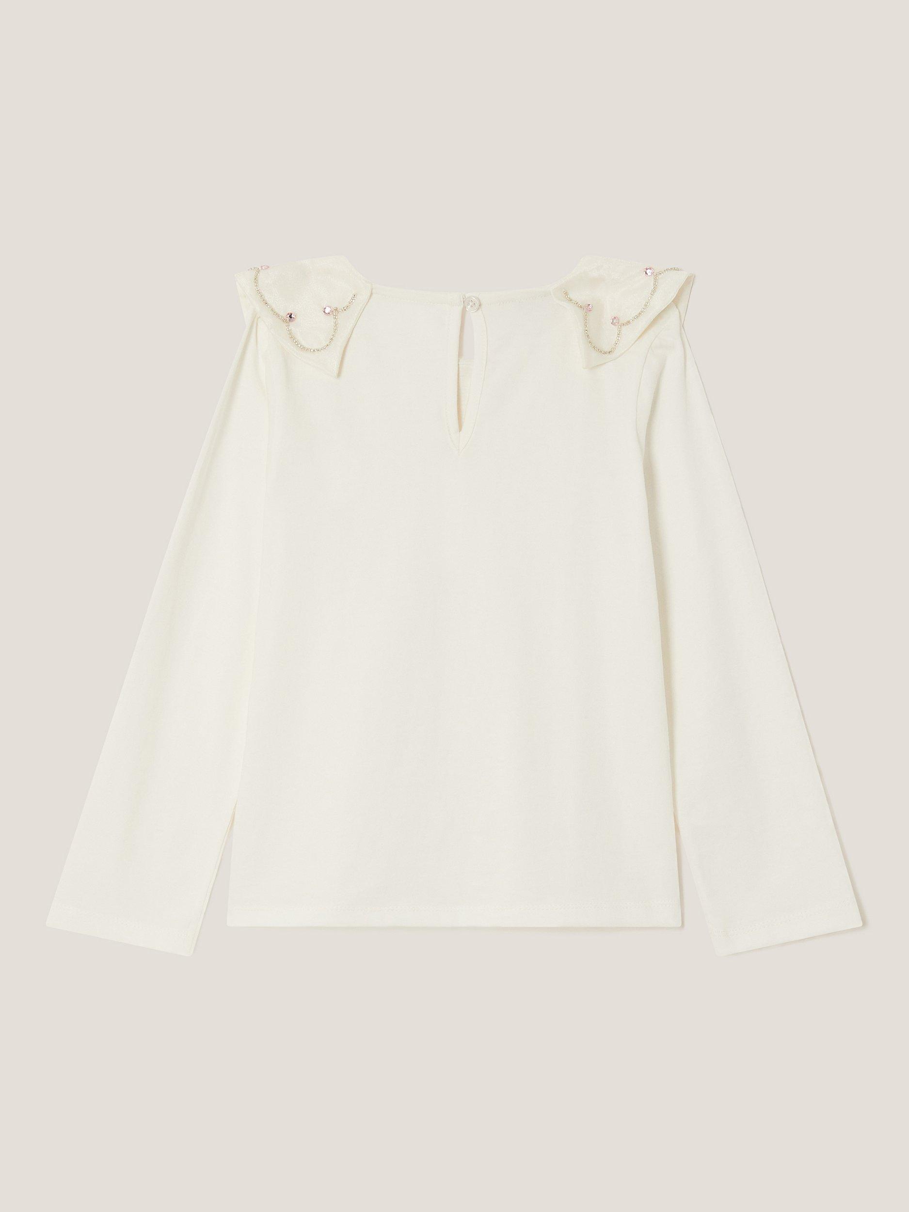 Product image 3 of 4, which shows Monsoon Kids' Cotton Bow Rhinestone Top, Ivory, 3-4 years