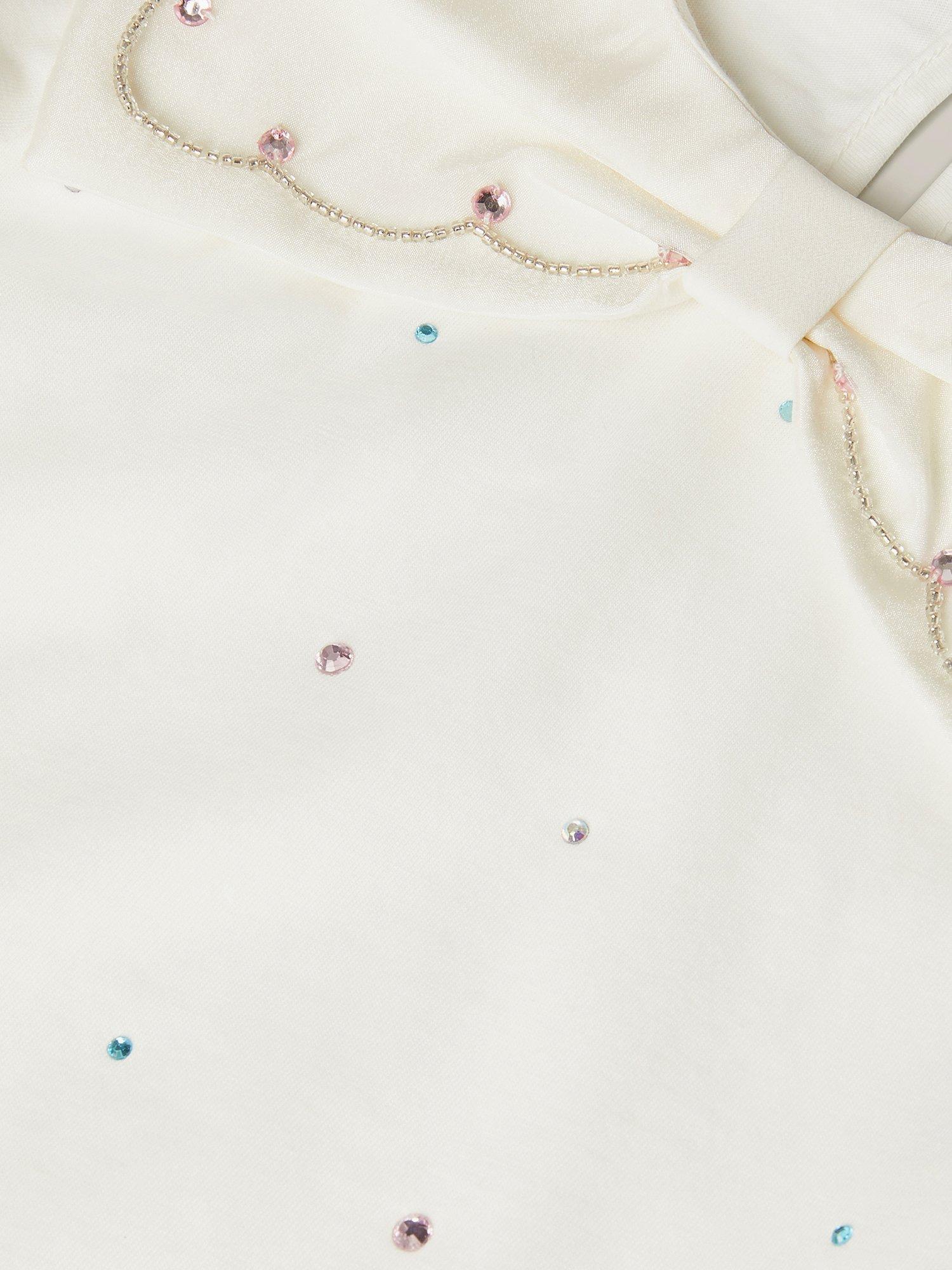 Product image 4 of 4, which shows Monsoon Kids' Cotton Bow Rhinestone Top, Ivory, 3-4 years
