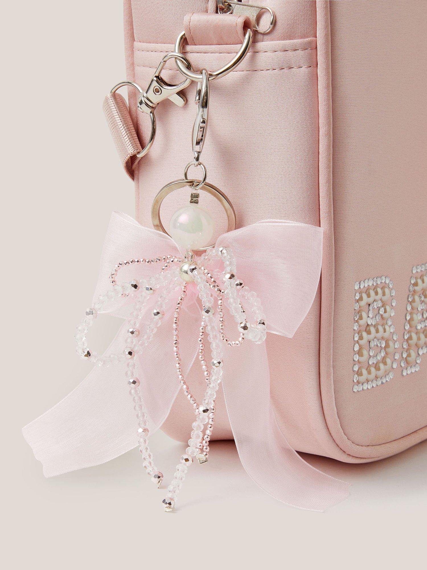 Product image 3 of 3, which shows Monsoon Kids' Bead & Ribbon Bow Bag Charm, Ivory