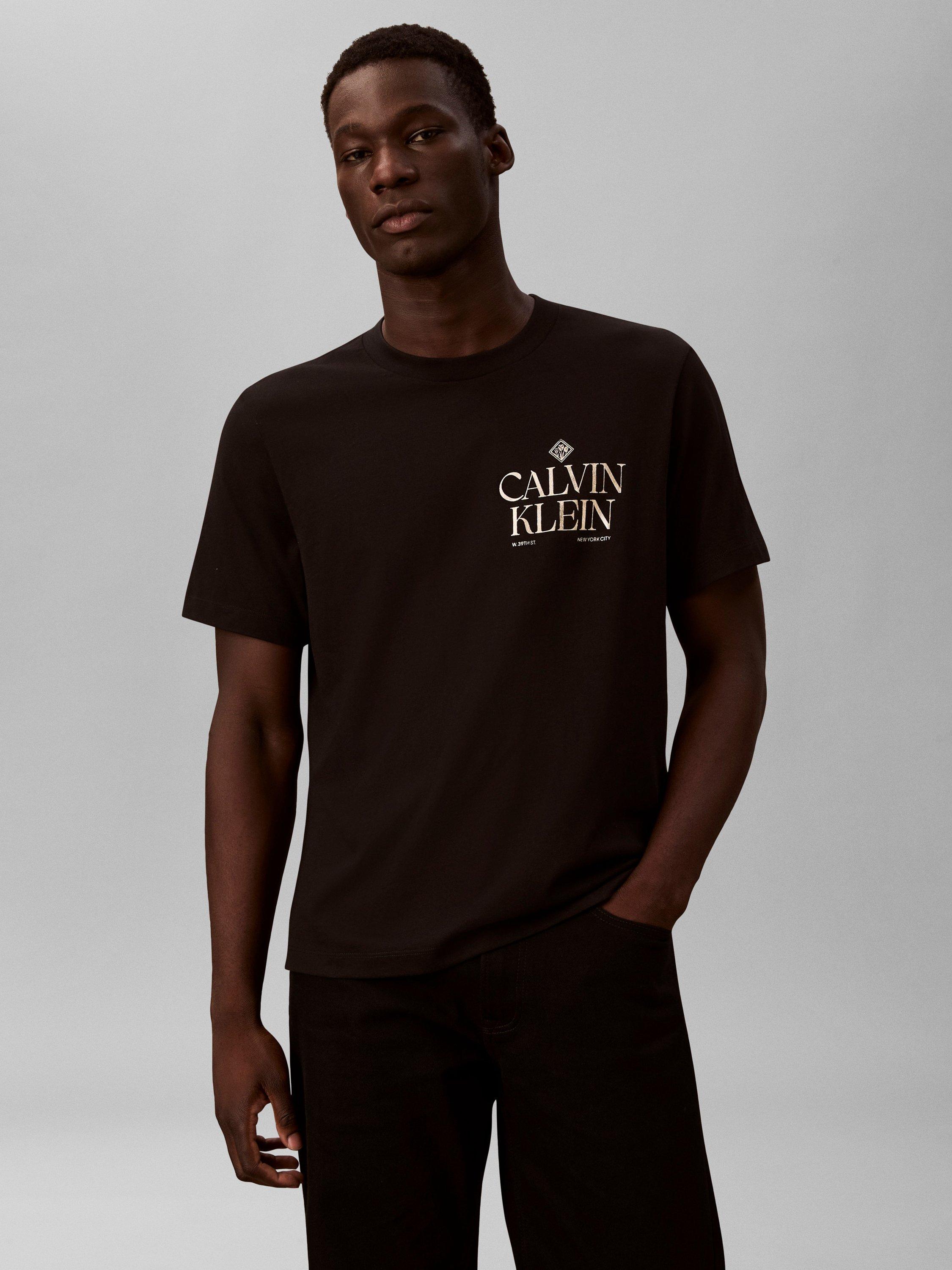 Product image 1 of 6, which shows Calvin Klein Logo Roses Graphic T-Shirt, Black, XS