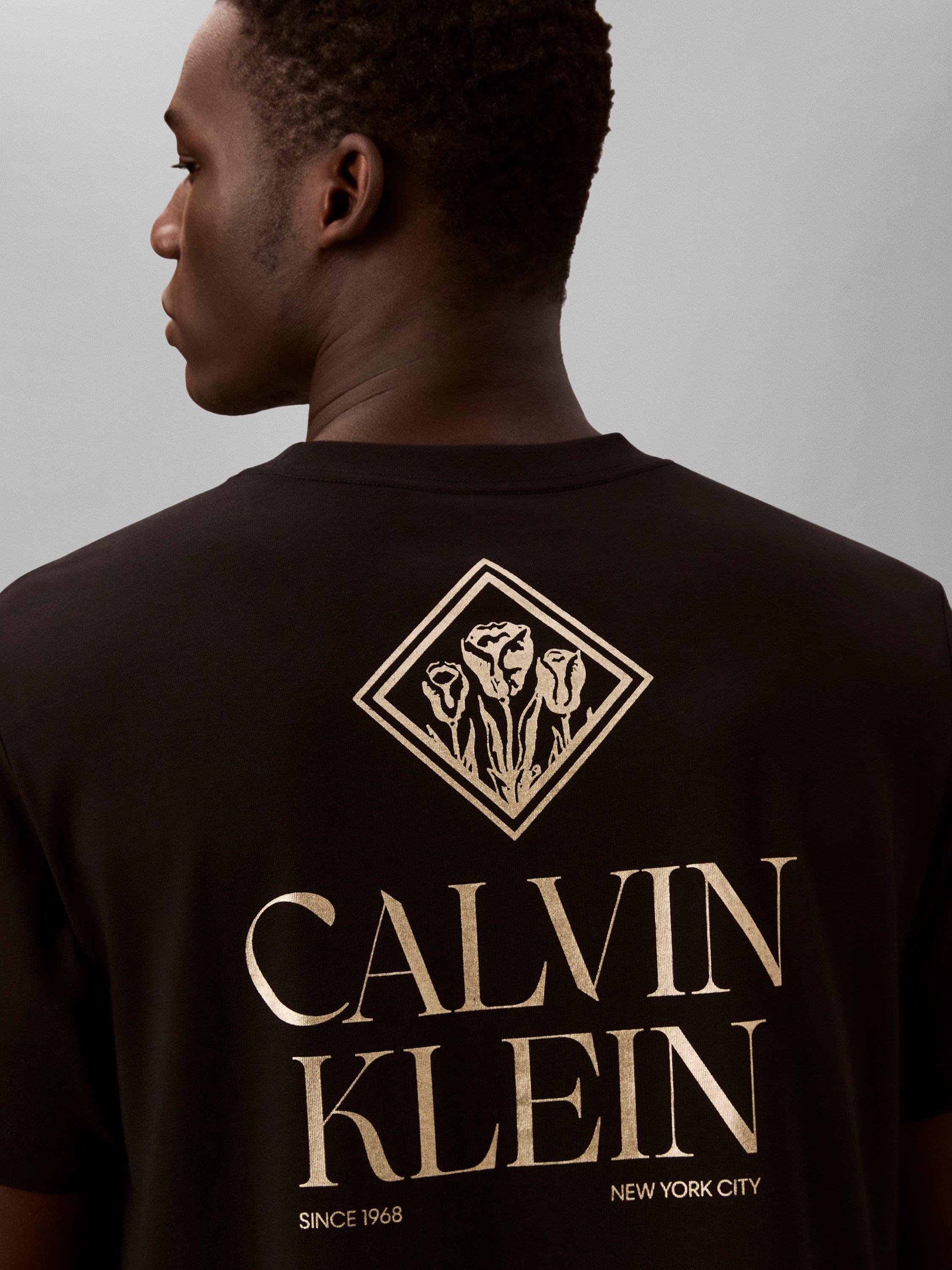 Product image 2 of 6, which shows Calvin Klein Logo Roses Graphic T-Shirt, Black, XS