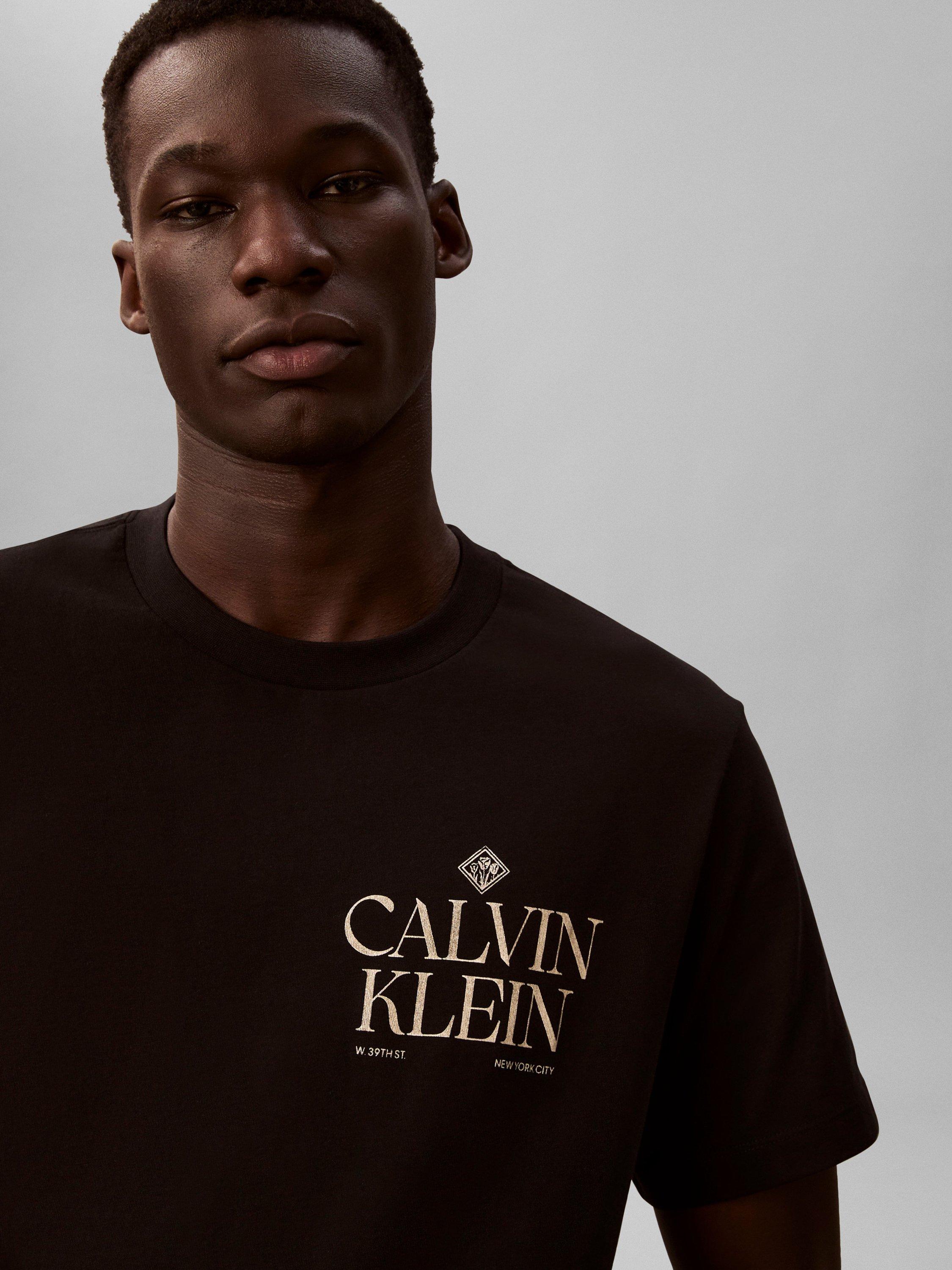 Product image 4 of 6, which shows Calvin Klein Logo Roses Graphic T-Shirt, Black, XS