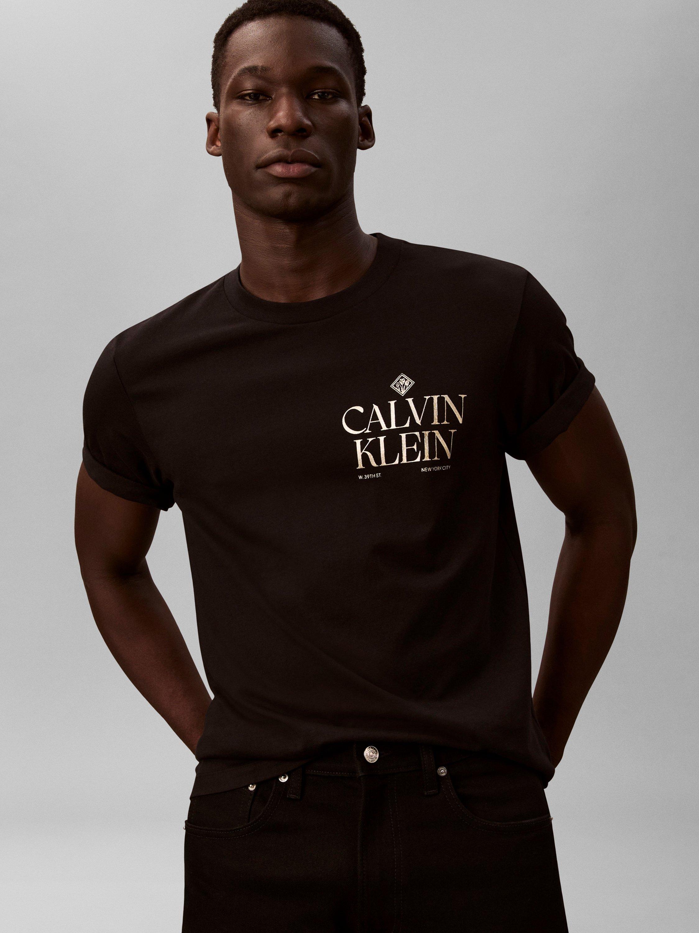 Product image 5 of 6, which shows Calvin Klein Logo Roses Graphic T-Shirt, Black, XS