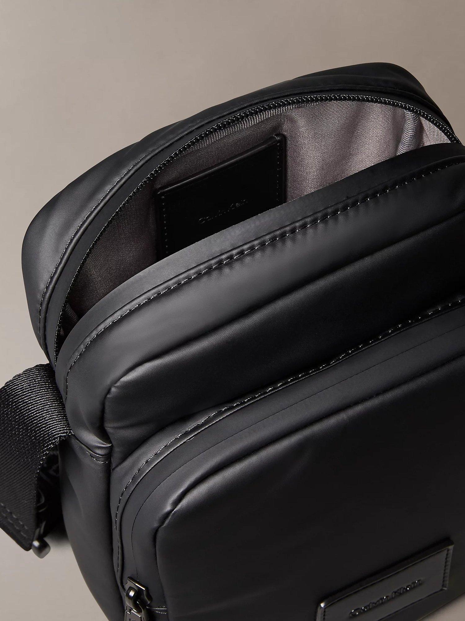 Product image 3 of 5, which shows Calvin Klein Puffer Utility Reporter Bag, Black, One Size