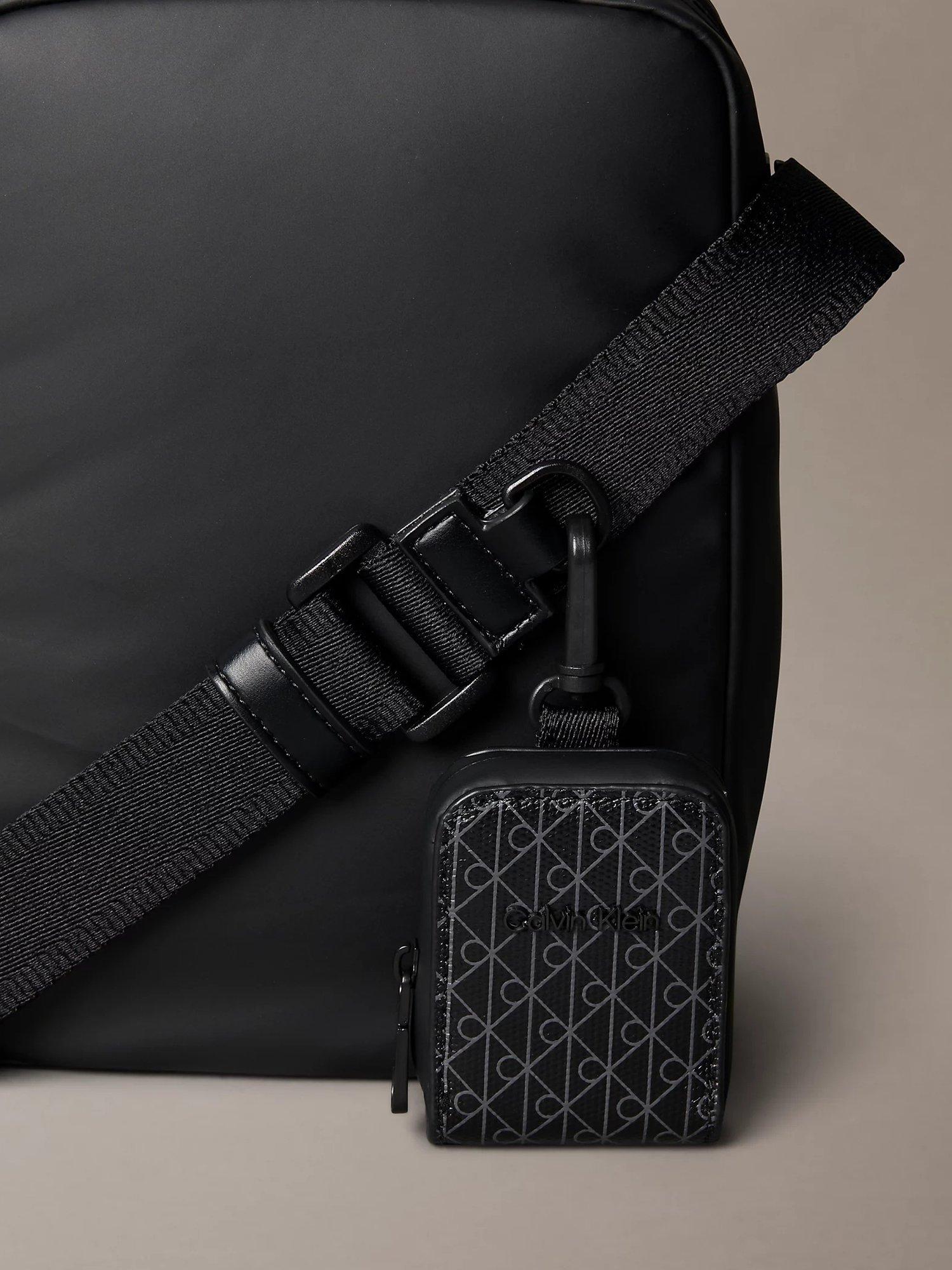 Product image 4 of 5, which shows Calvin Klein Puffer Utility Reporter Bag, Black, One Size