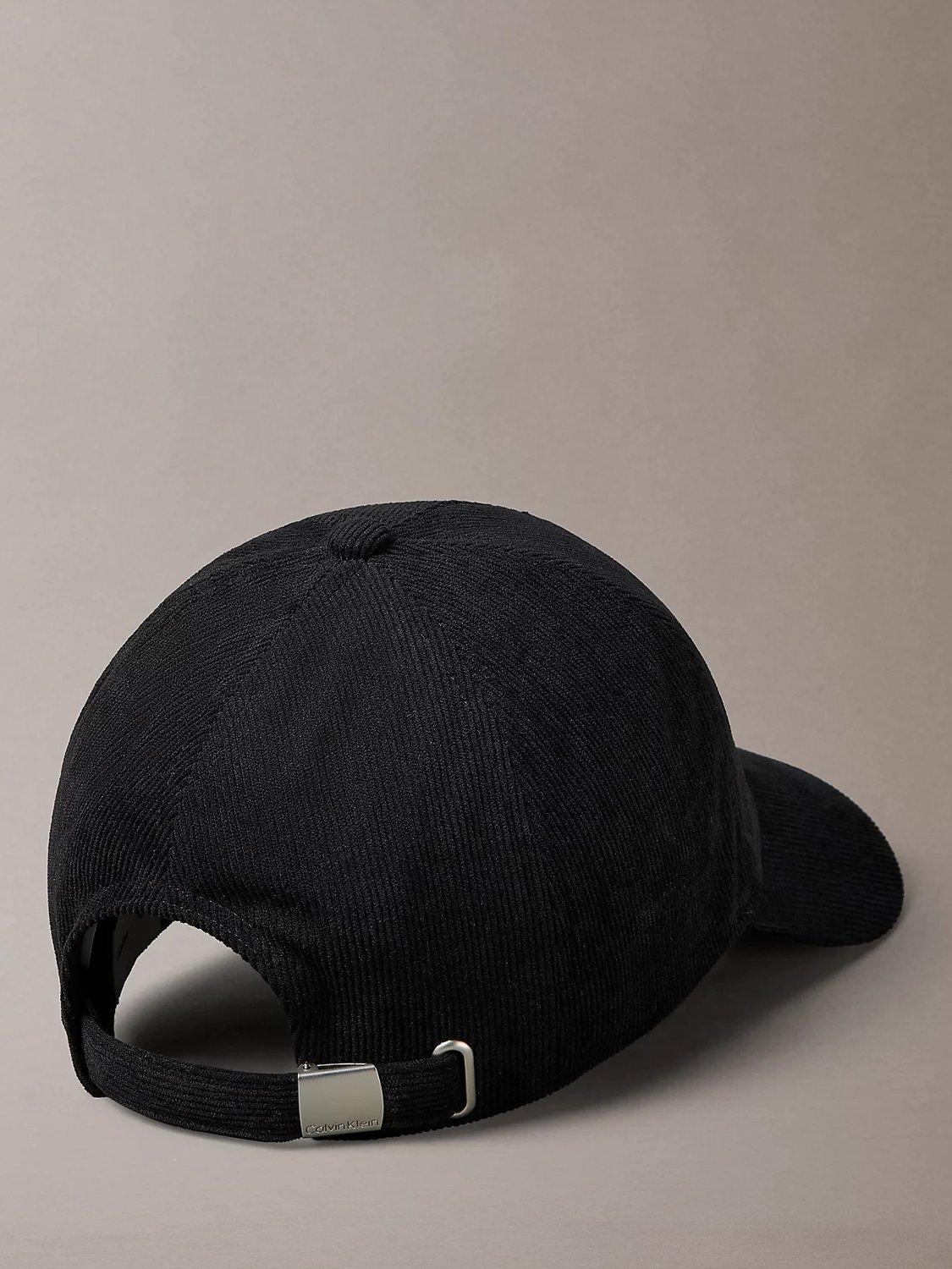 Product image 2 of 4, which shows Calvin Klein Logo Corduroy Baseball Cap, Black, One Size