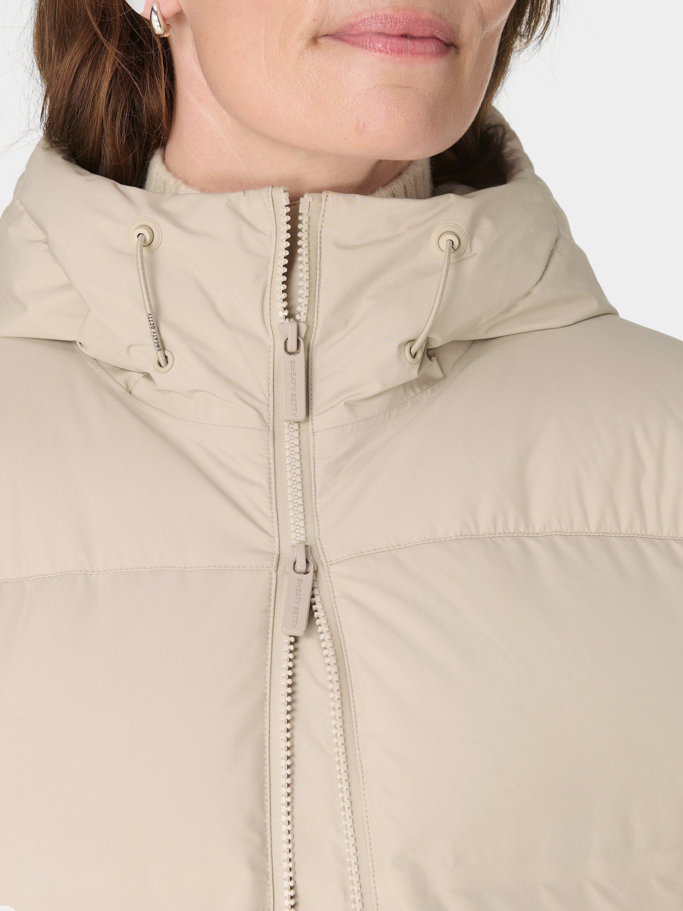 Product image 8 of 9, which shows Sweaty Betty Waterproof Puffer Coat, Dusk Beige, XL
