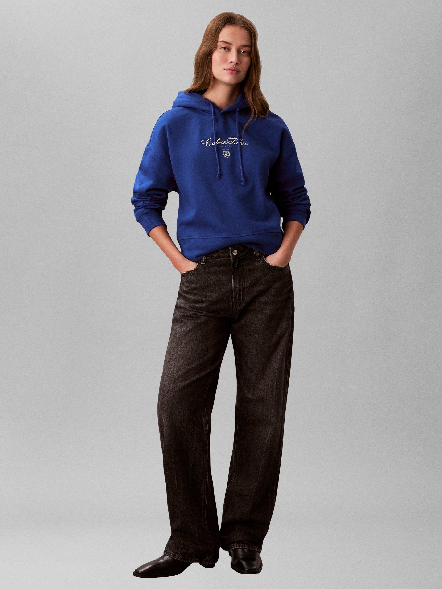 Product image 1 of 6, which shows Calvin Klein Script Logo Cropped Hoodie, Admiral Blue, XS