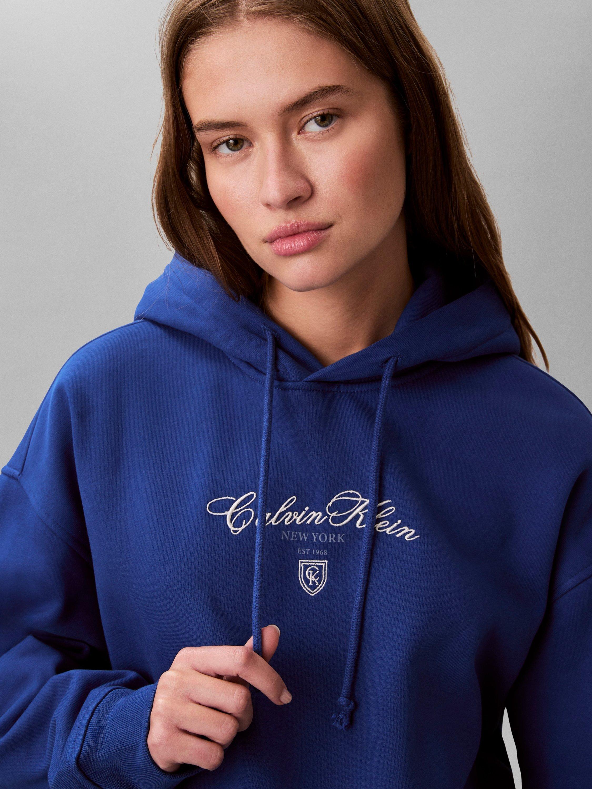 Product image 4 of 6, which shows Calvin Klein Script Logo Cropped Hoodie, Admiral Blue, XS