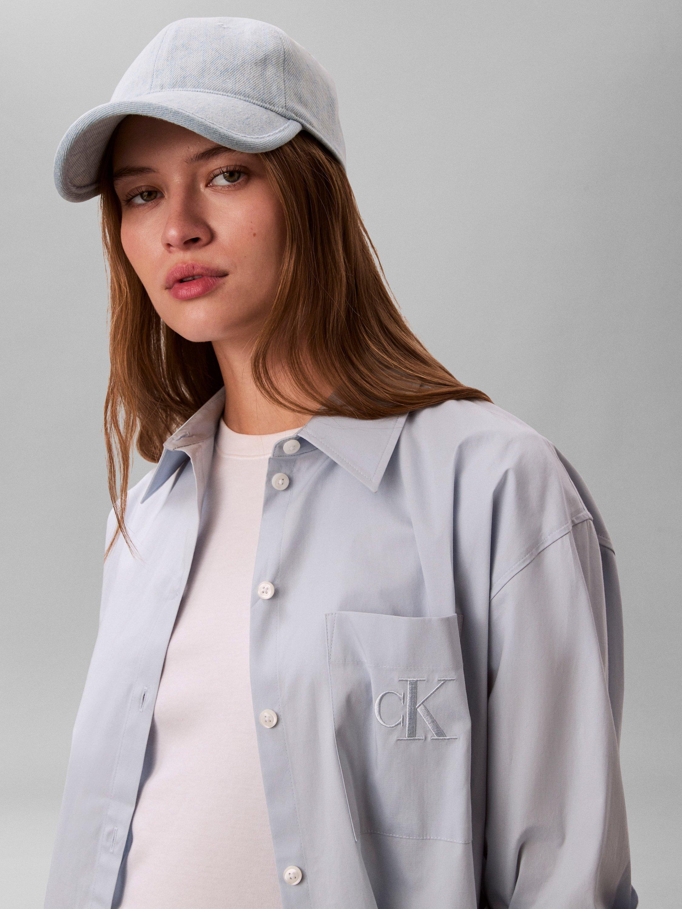 Product image 4 of 4, which shows Calvin Klein Burnout Emblem Logo Denim Baseball Cap, Light Wash Blue, One Size