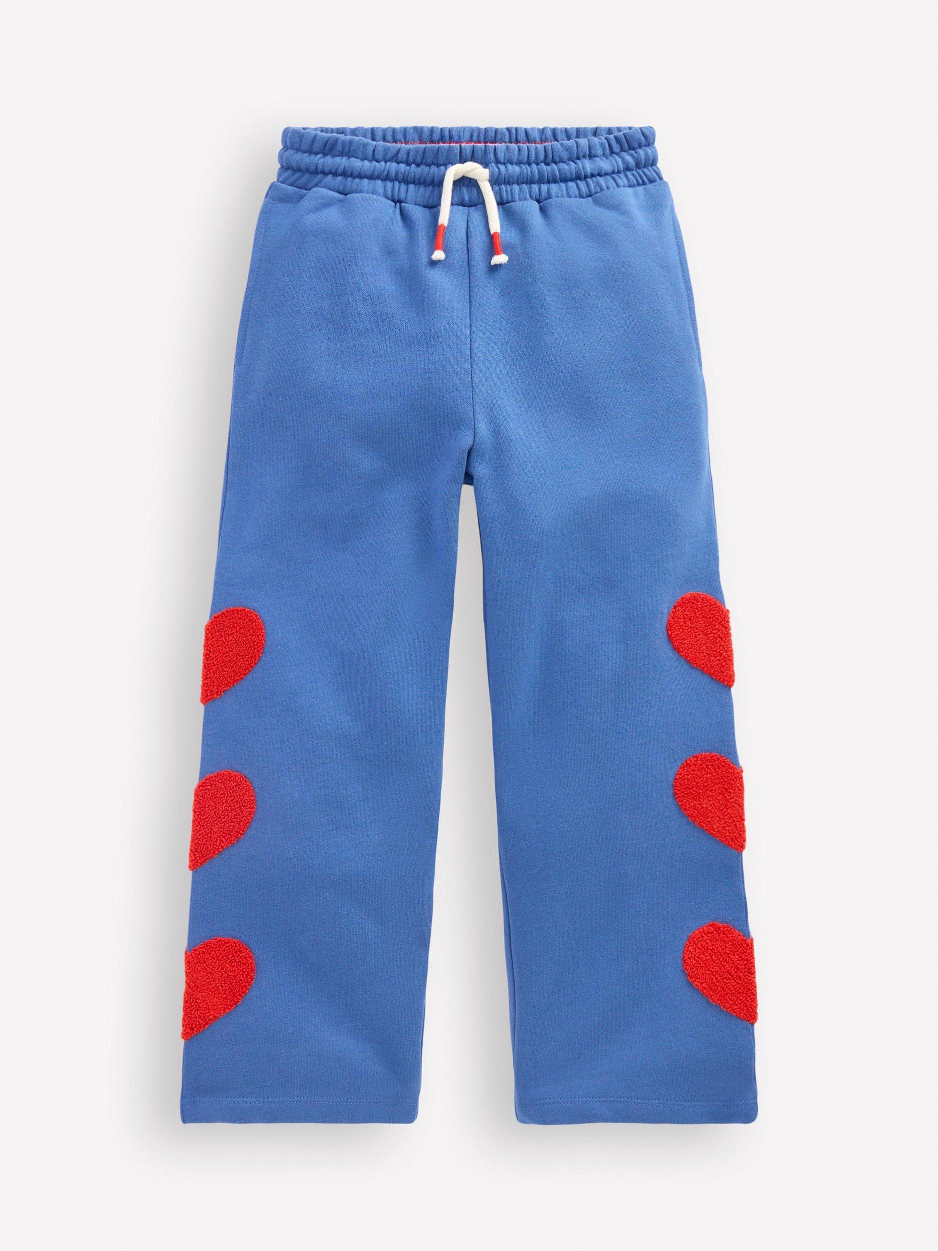 Product image 1 of 3, which shows Mini Boden Kids' Bobbie Cotton Drawstring Applique Joggers, Bluejay Hearts, 2-3 years