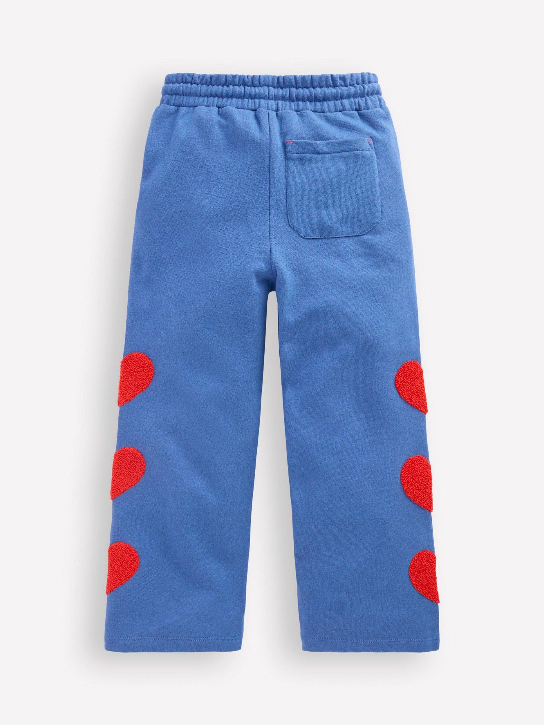 Product image 2 of 3, which shows Mini Boden Kids' Bobbie Cotton Drawstring Applique Joggers, Bluejay Hearts, 2-3 years
