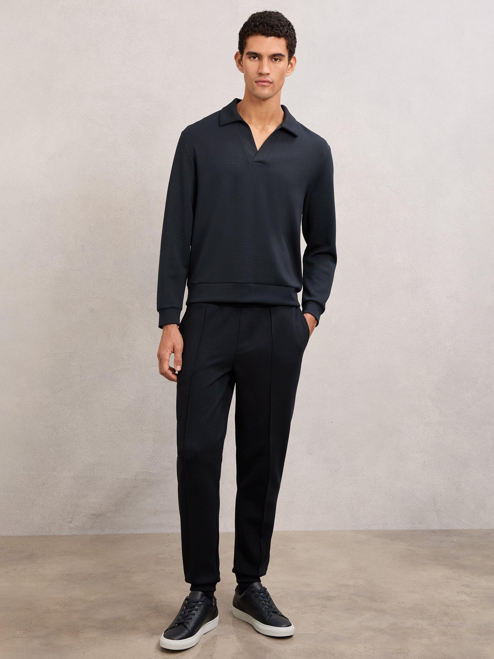 Product image 4 of 5, which shows Reiss Pearson Buttonless Long Sleeve Polo Shirt, Navy Blue, XL