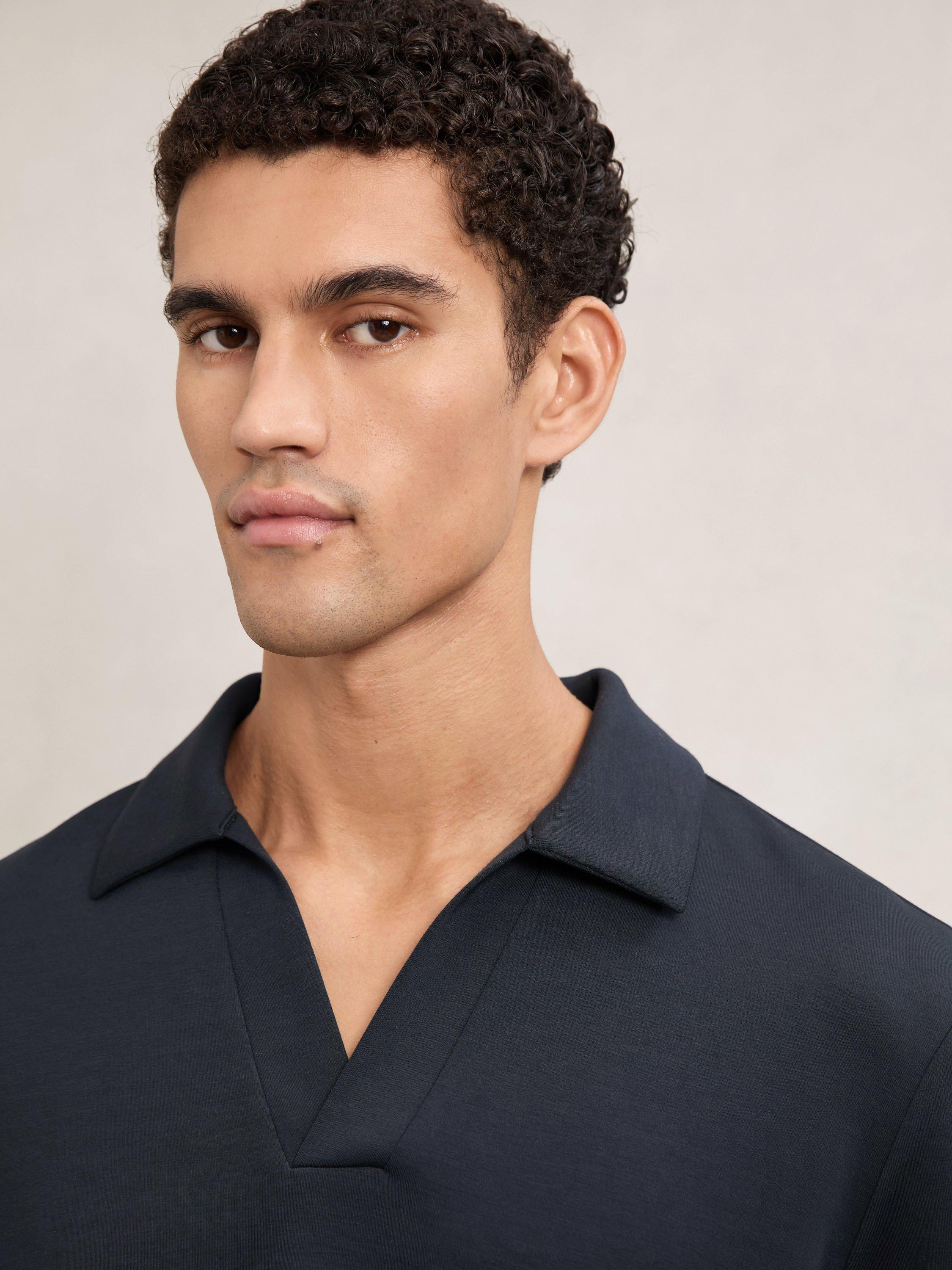 Product image 5 of 5, which shows Reiss Pearson Buttonless Long Sleeve Polo Shirt, Navy Blue, XL