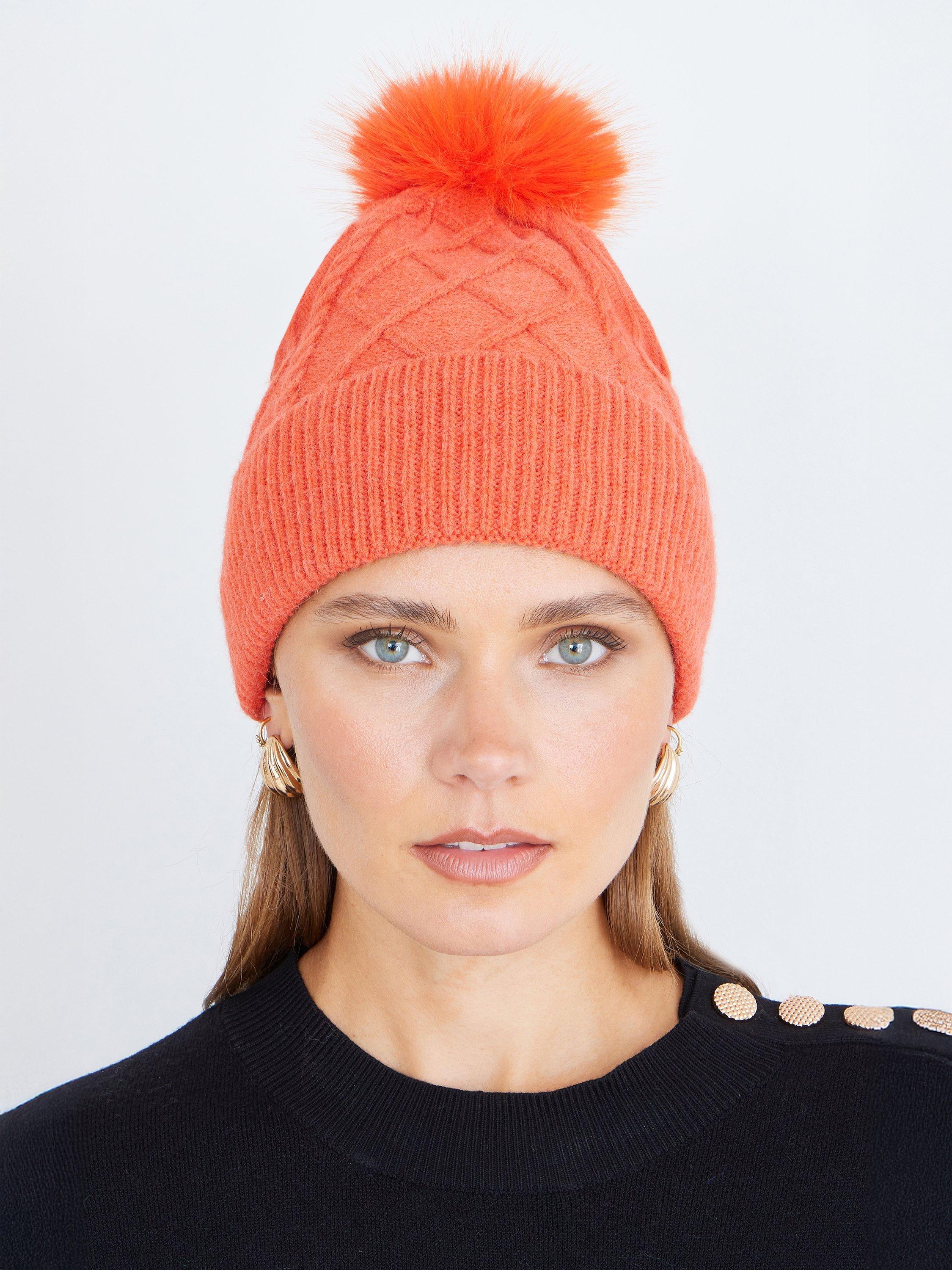 Product image 1 of 3, which shows Yumi Cable Knit Pom-Pom Hat, Orange, One Size