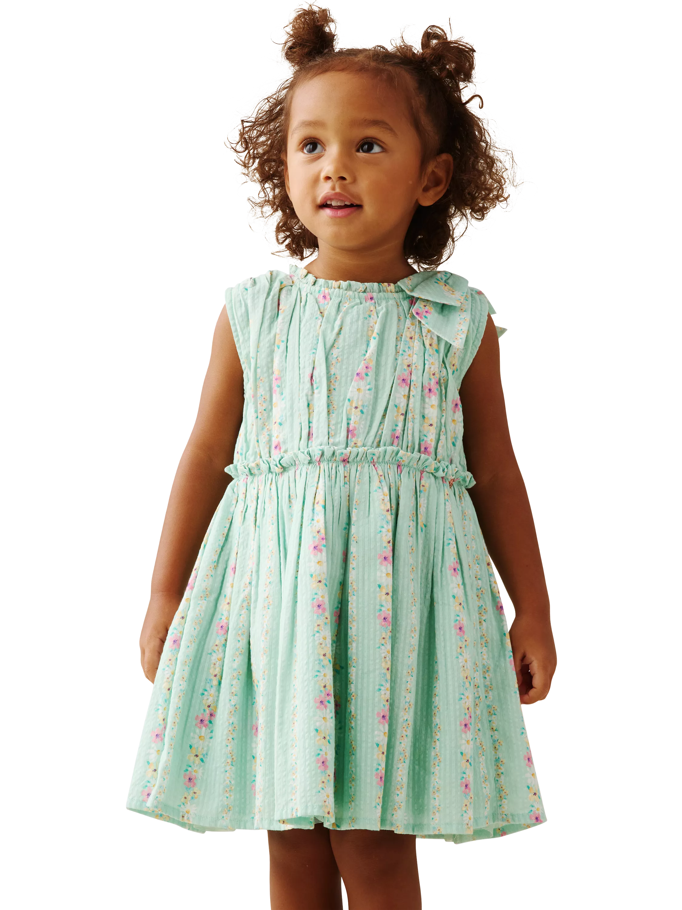 baby girl wearing pale green summer dress