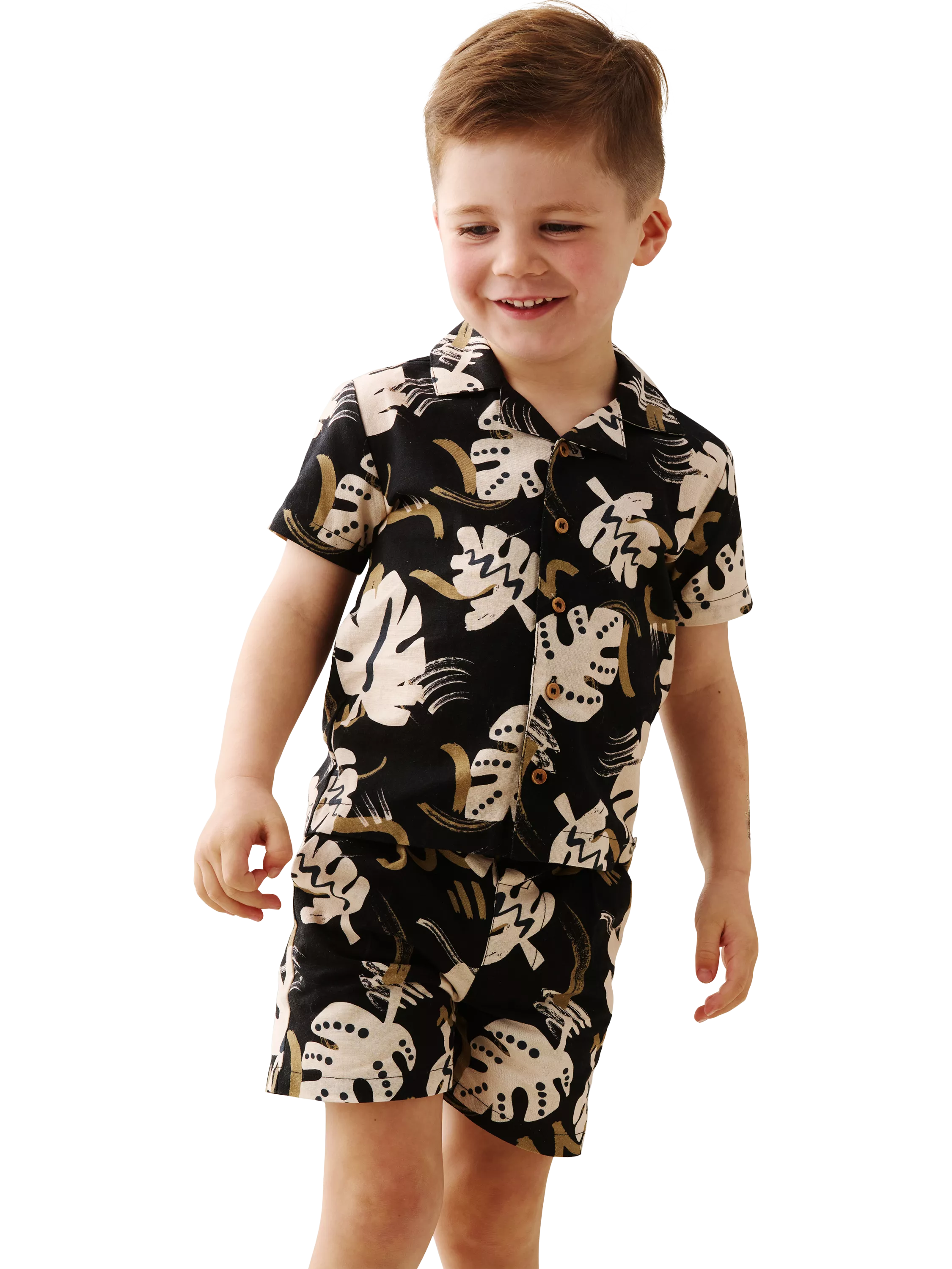 baby boy wearing a printed short sleeve shirt and shorts