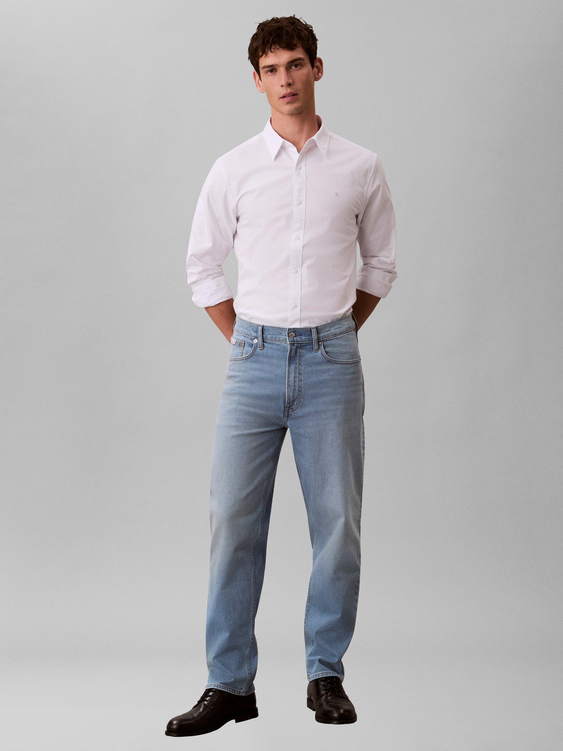 Product image 1 of 6, which shows Calvin Klein 90S Taper Leg Jeans, Ashland, W28/L32
