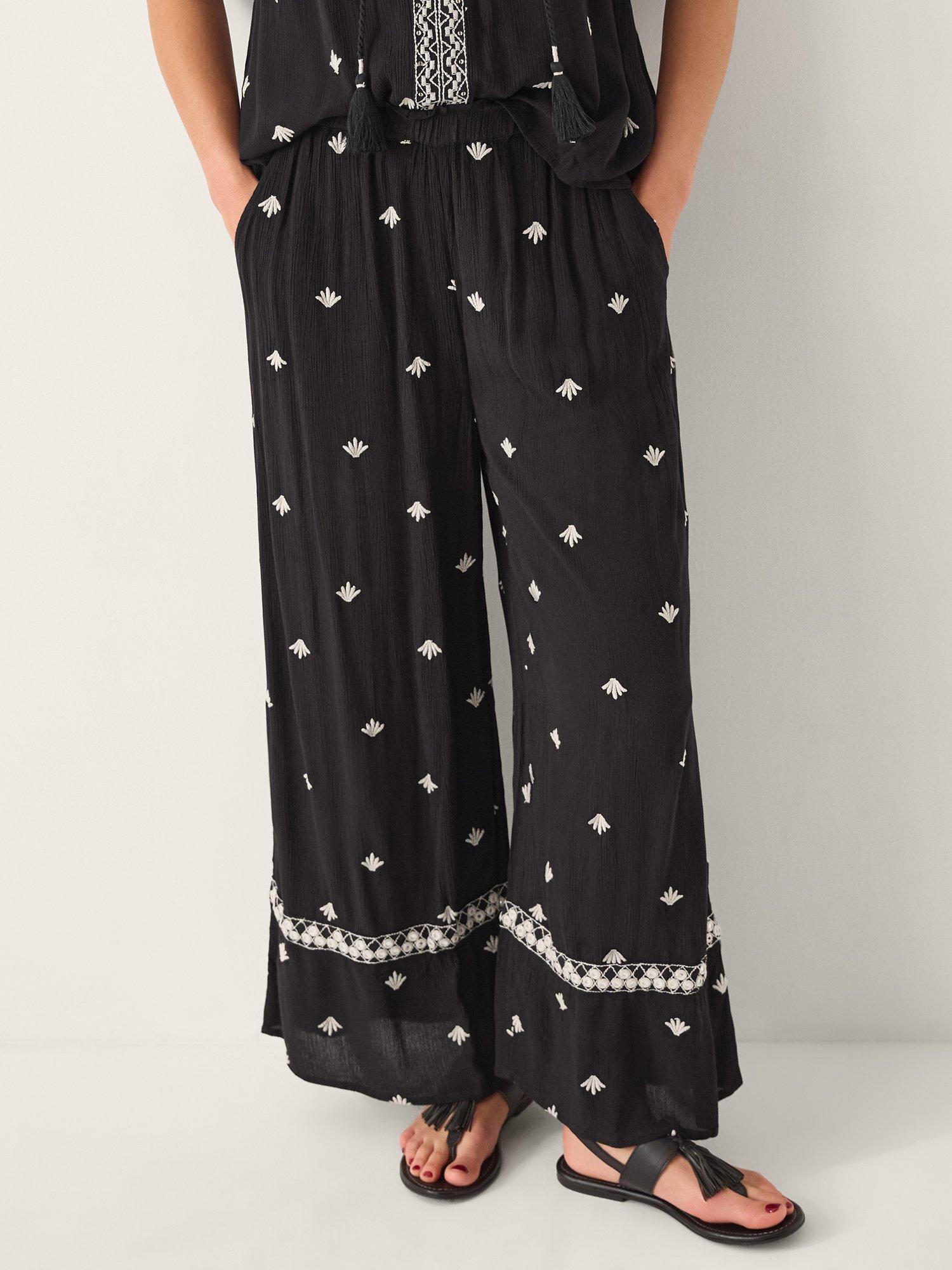 Product image 1 of 4, which shows Monsoon Samara Embroidered Wide Leg Trousers, Black, S