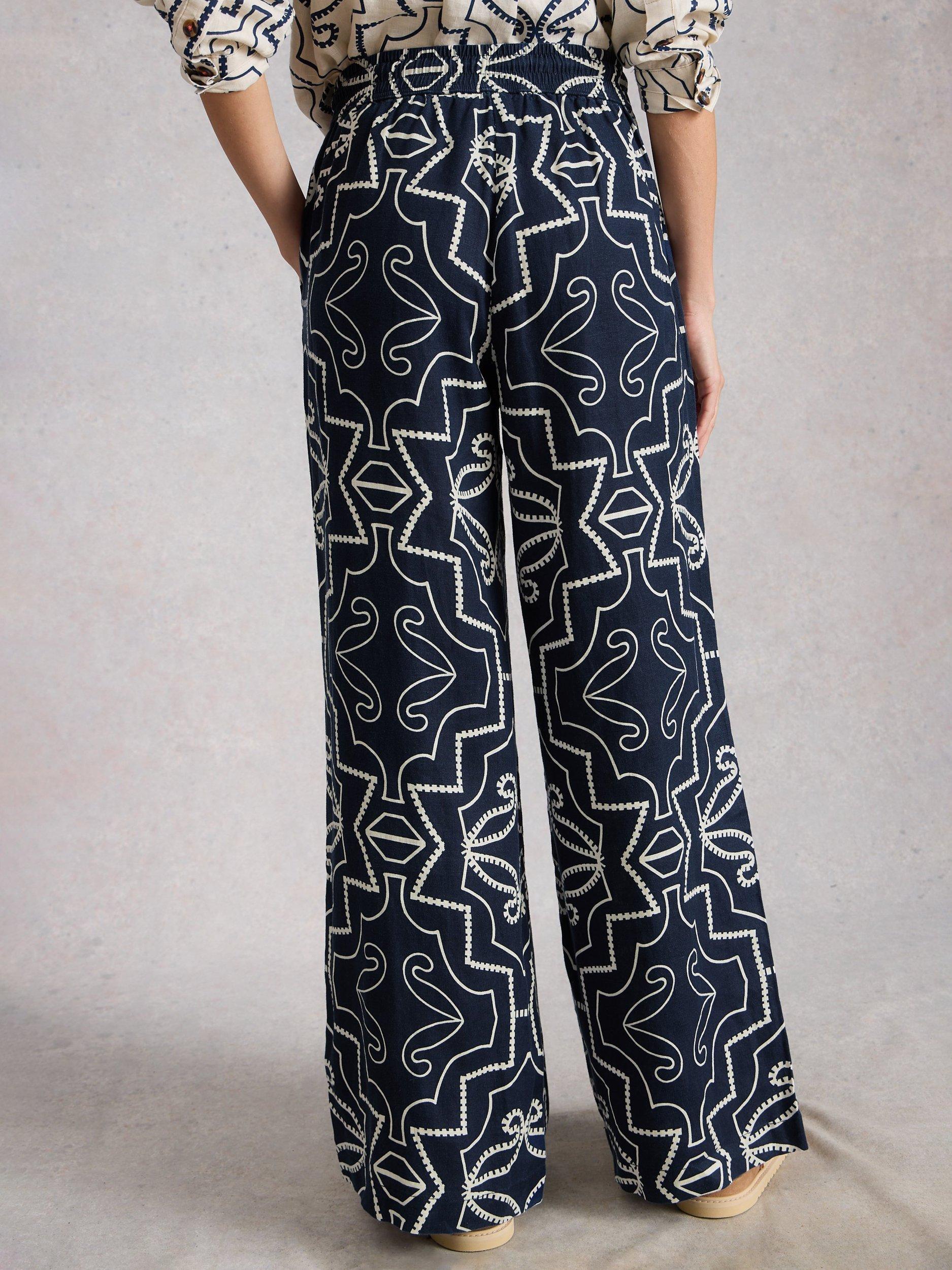 Product image 2 of 6, which shows White Stuff Ally Abstract Pure Linen Trousers, Navy/White, 6S