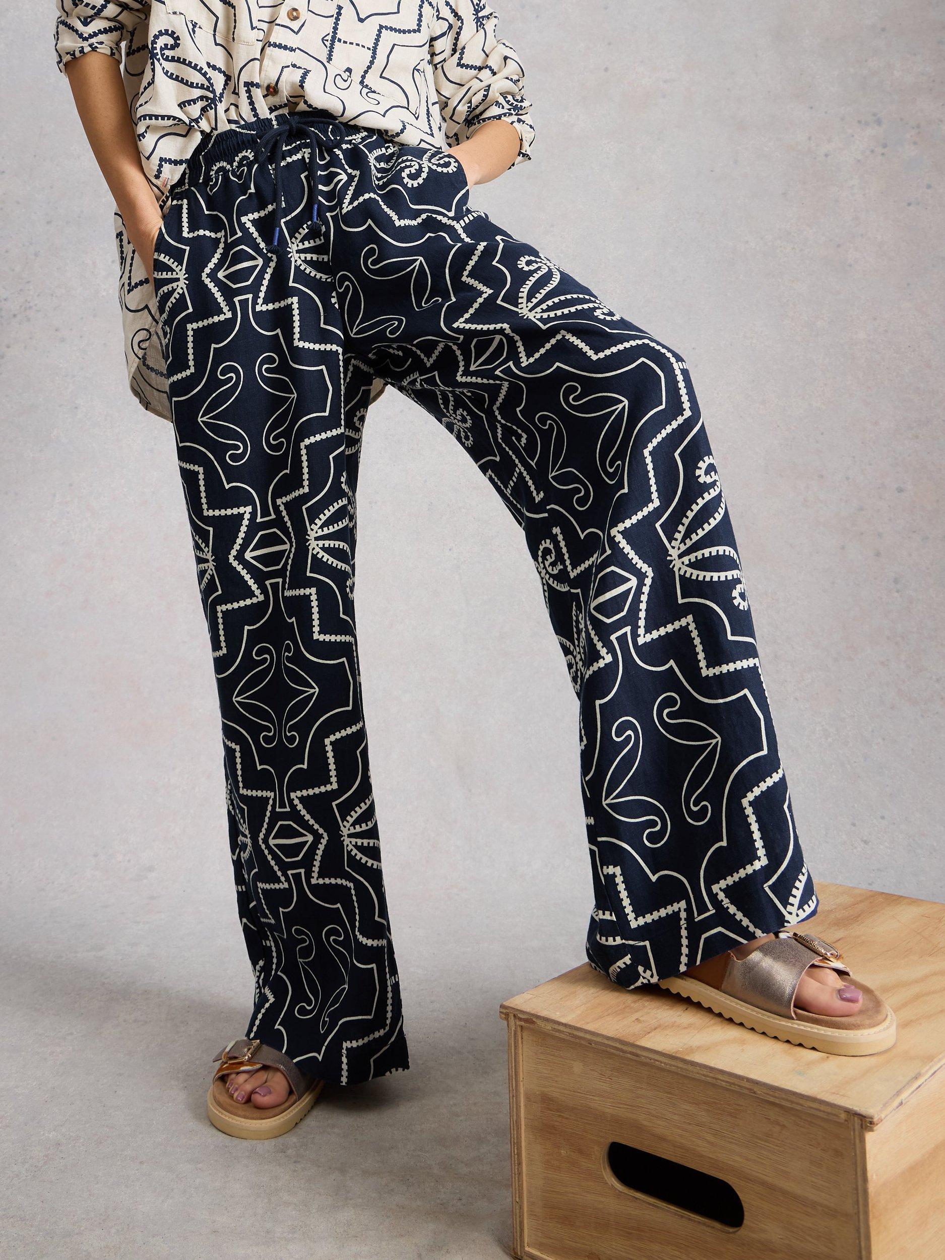 Product image 4 of 6, which shows White Stuff Ally Abstract Pure Linen Trousers, Navy/White, 6S