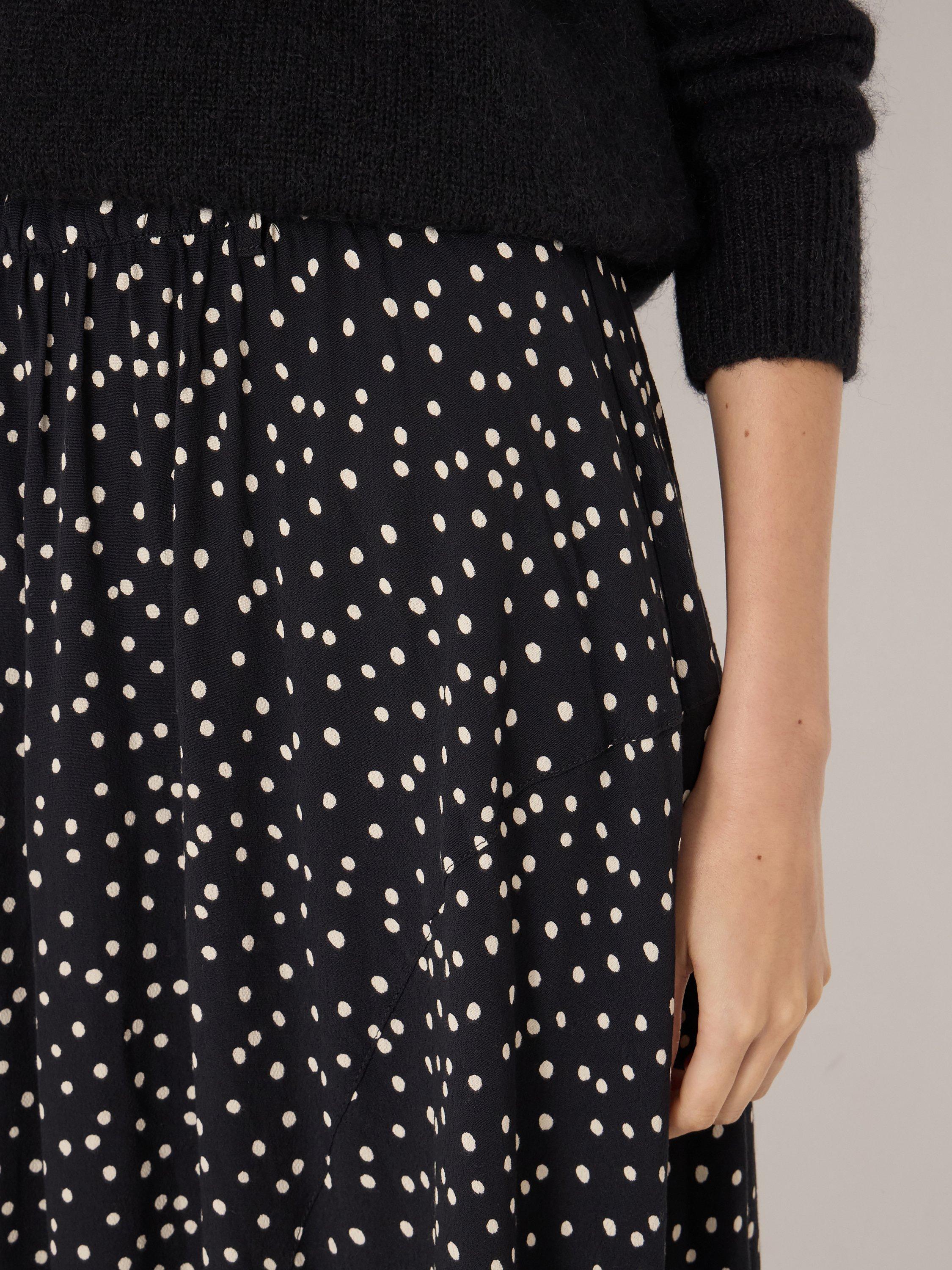 Product image 3 of 6, which shows HUSH Cesca Polka Dot Asymmetric Skirt, Black/White, L-XL