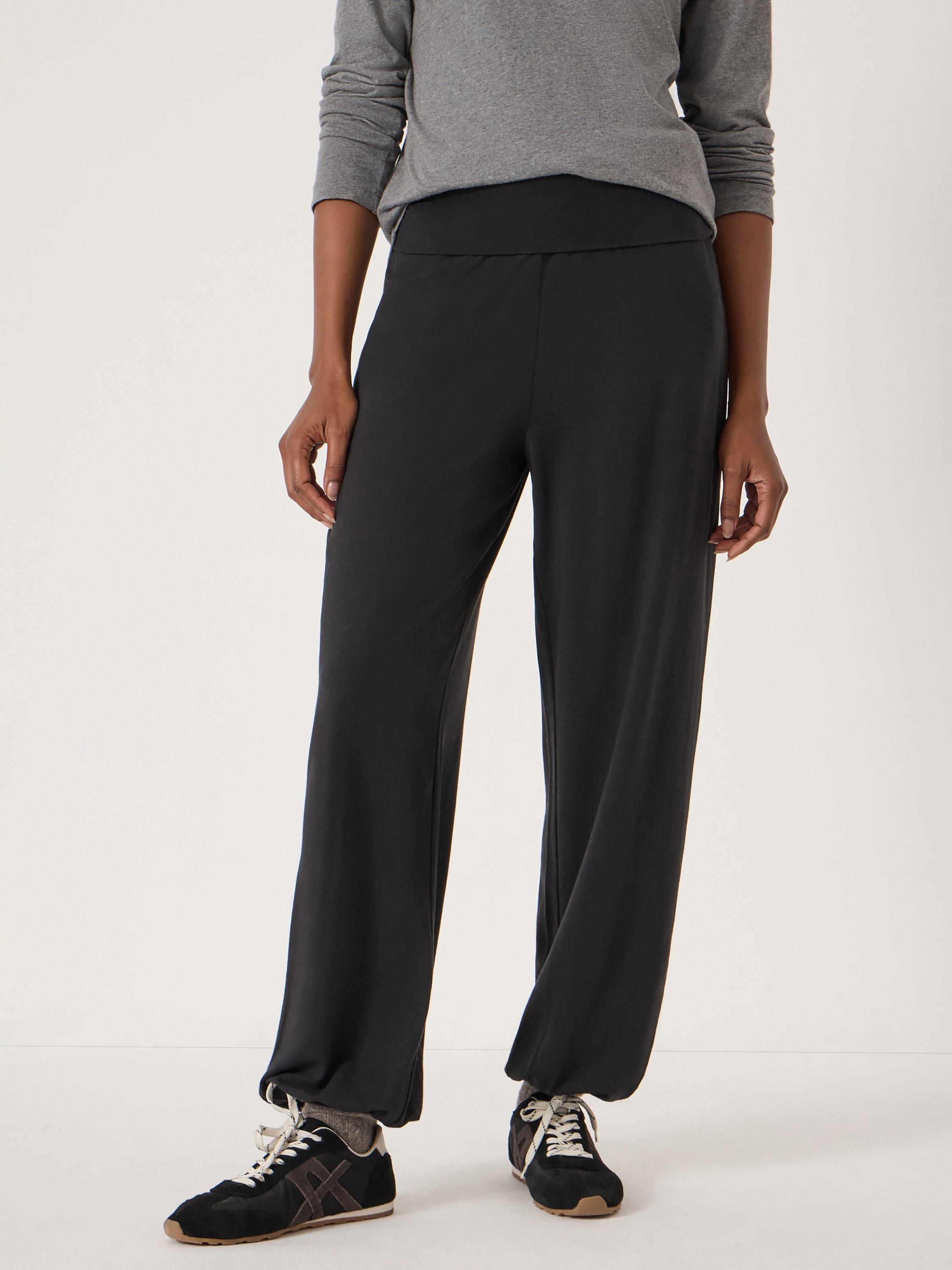 Product image 1 of 5, which shows HUSH Amelia Bubble Hem Trousers, Black, L-XL