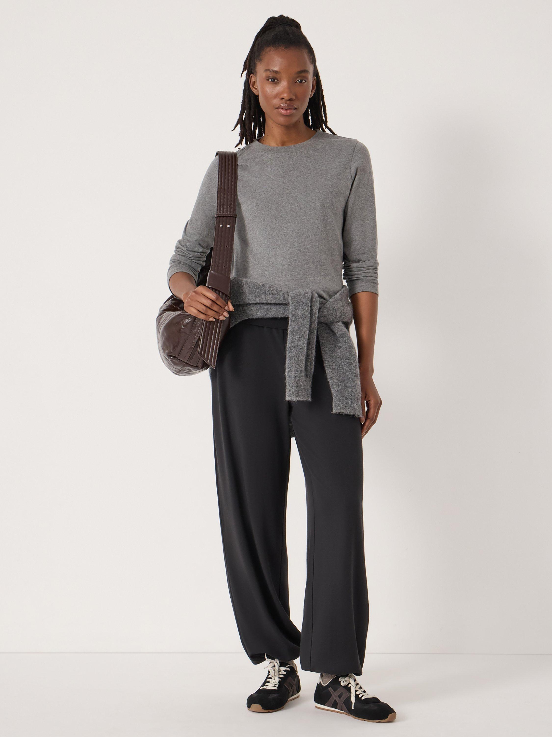 Product image 2 of 5, which shows HUSH Amelia Bubble Hem Trousers, Black, L-XL