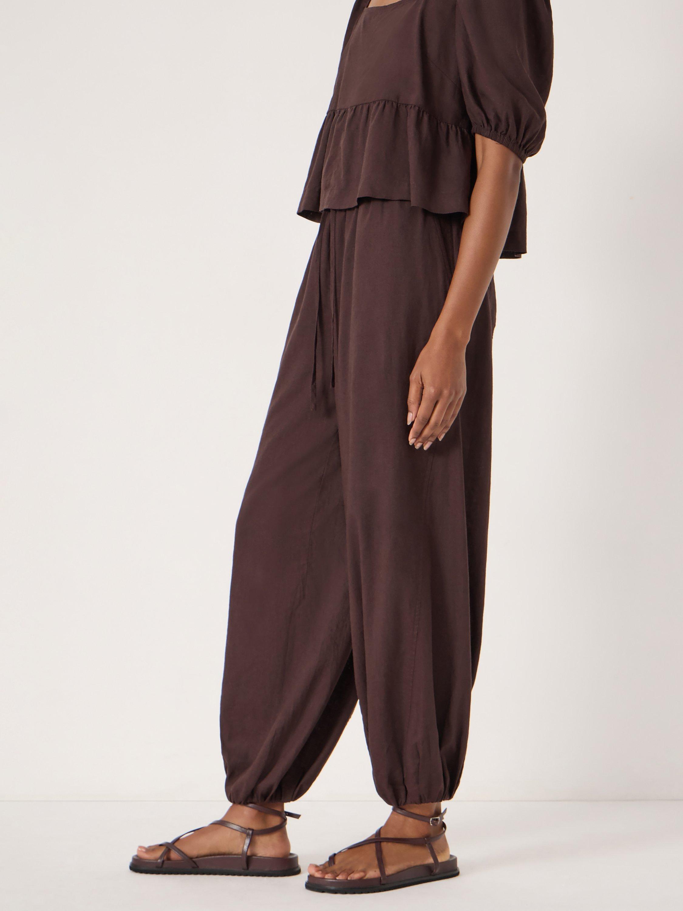 Product image 3 of 7, which shows HUSH Tove Beach Trousers, Dark Brown, L-XL