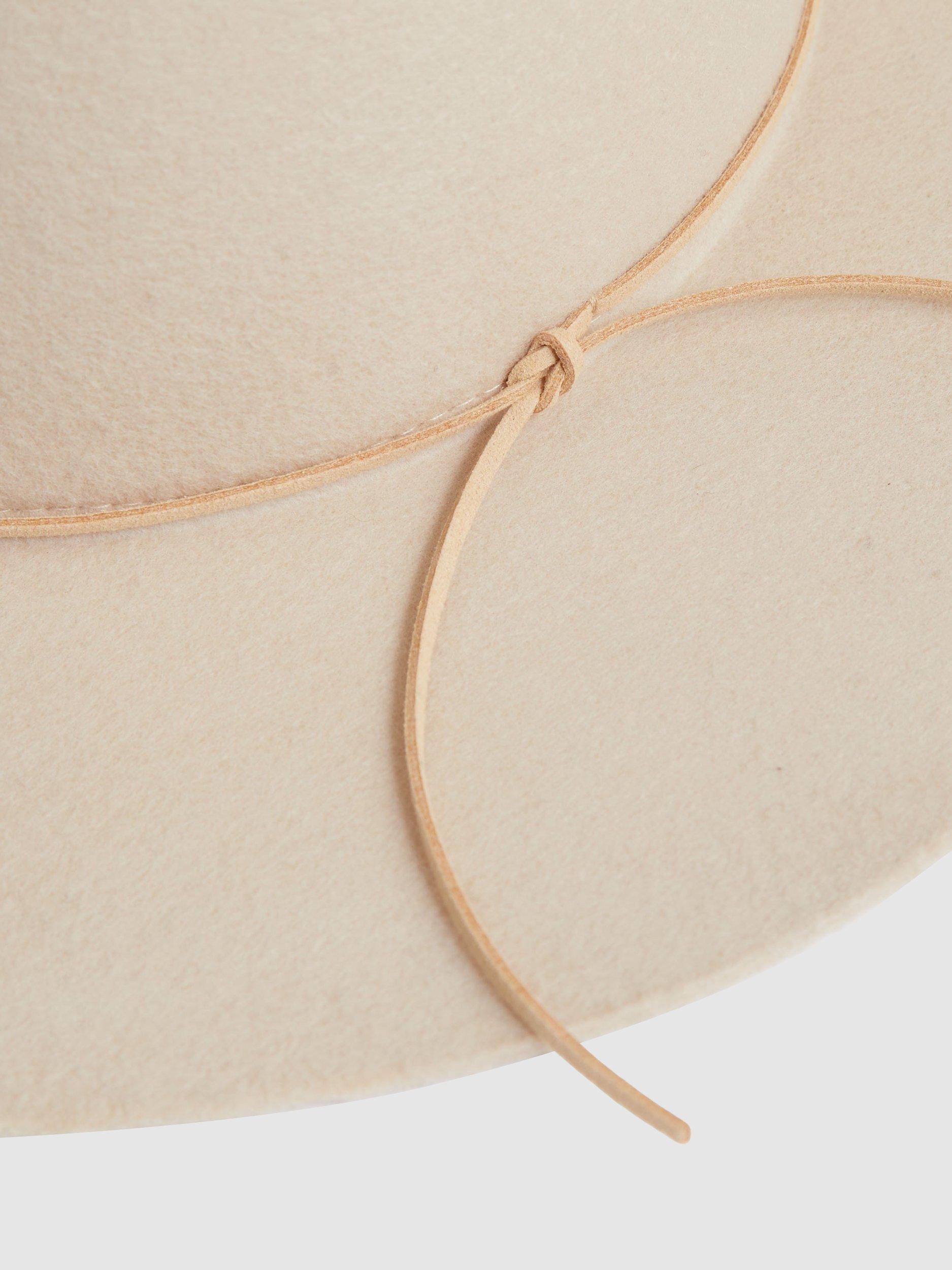 Product image 2 of 5, which shows Reiss Lucy Wool Trim Detail Hat, Neutral, S-M