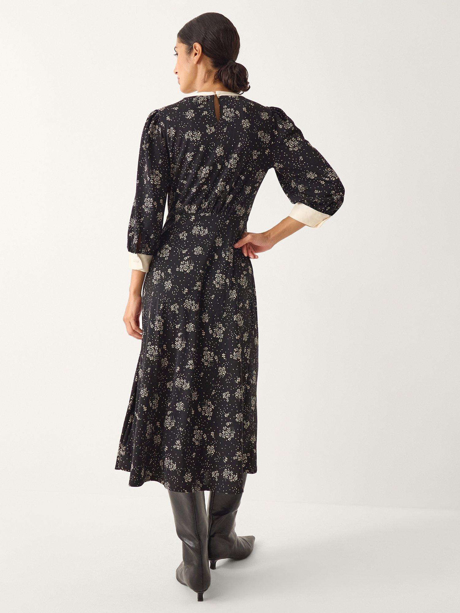 Product image 2 of 5, which shows Monsoon Dotty Bow Floral Jersey Midi Dress, Black, S
