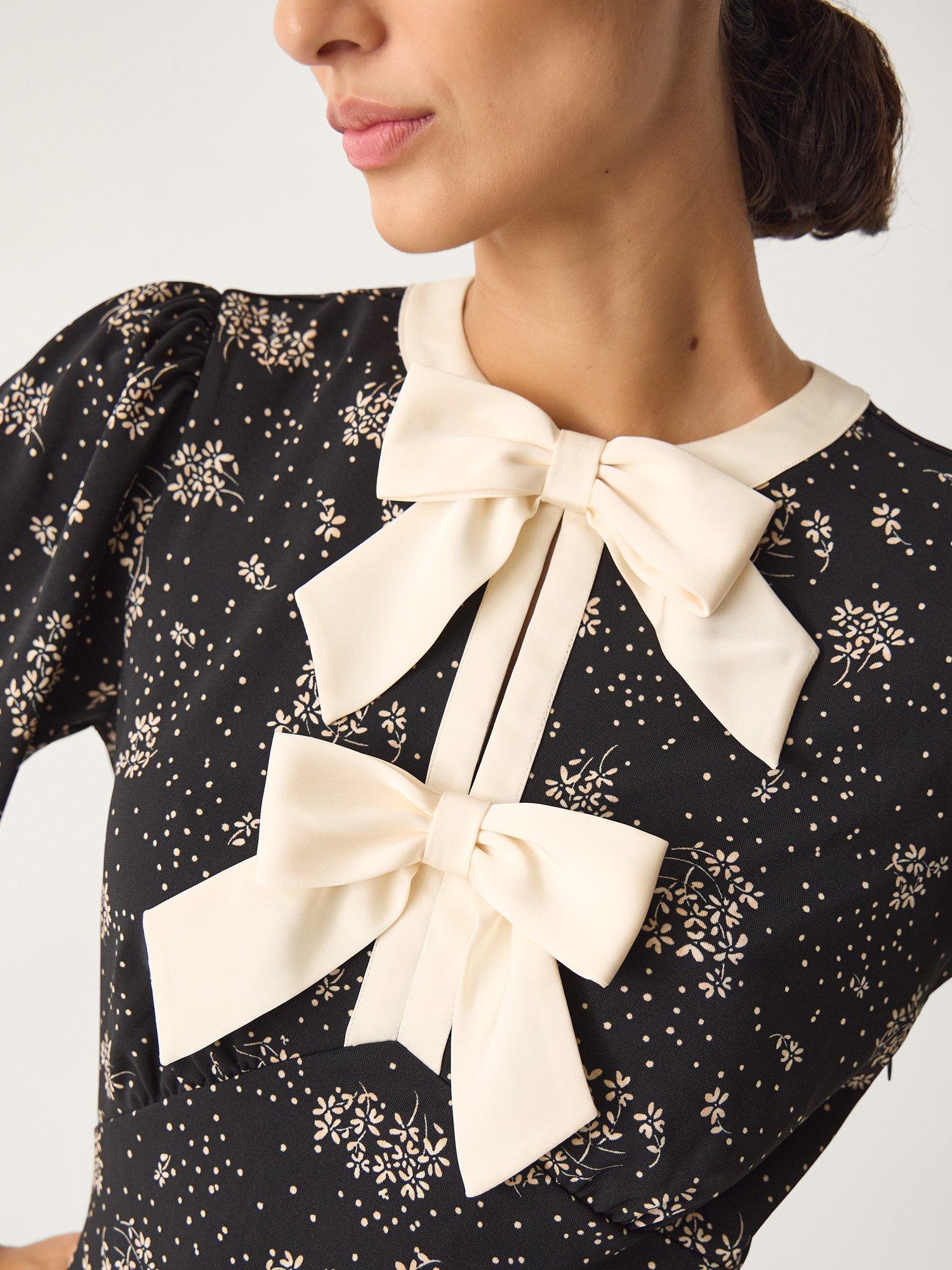 Product image 4 of 5, which shows Monsoon Dotty Bow Floral Jersey Midi Dress, Black, S