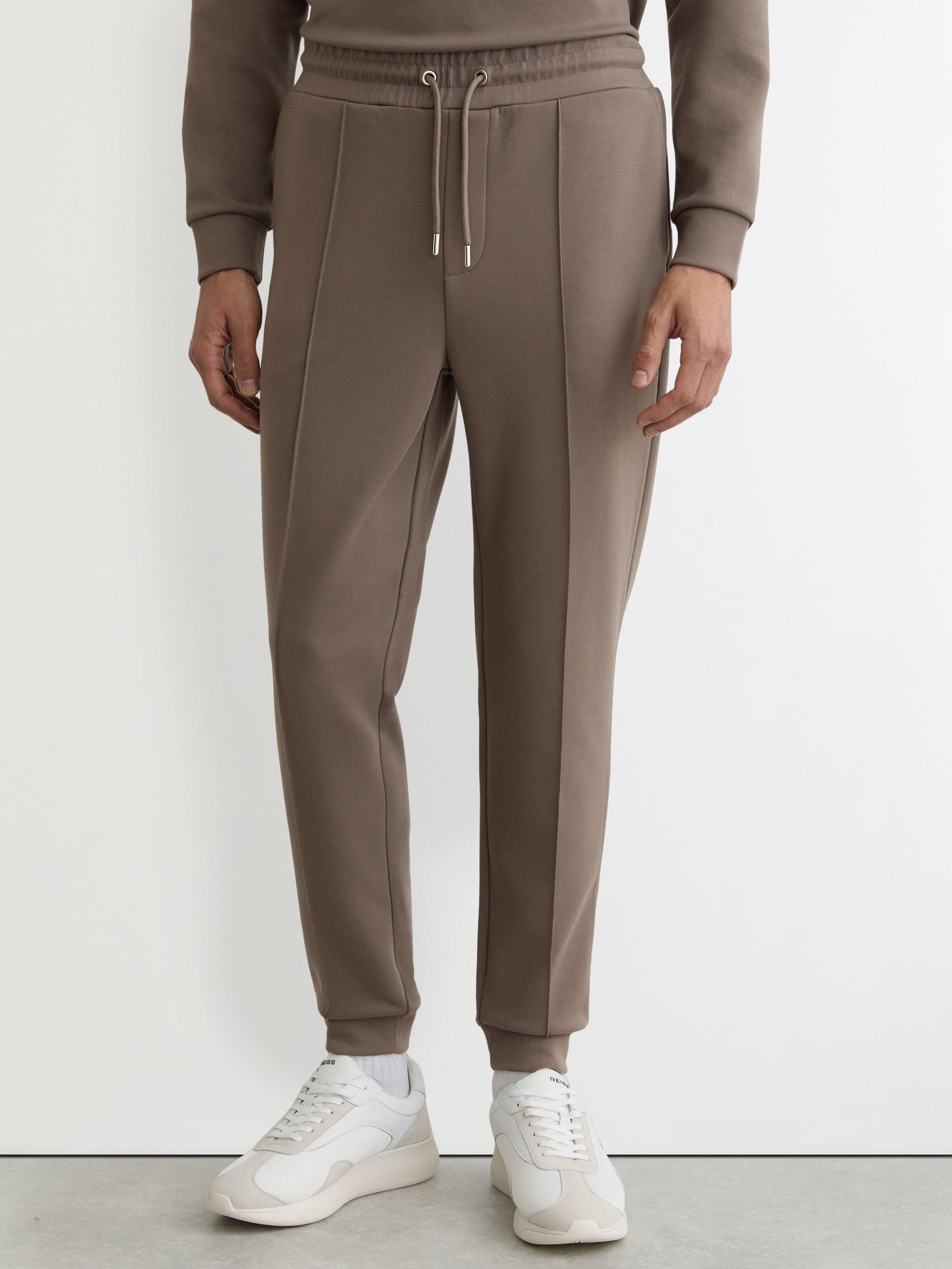 Product image 1 of 5, which shows Reiss Premier Premium Interlock Jersey Joggers, Light Brown, XS