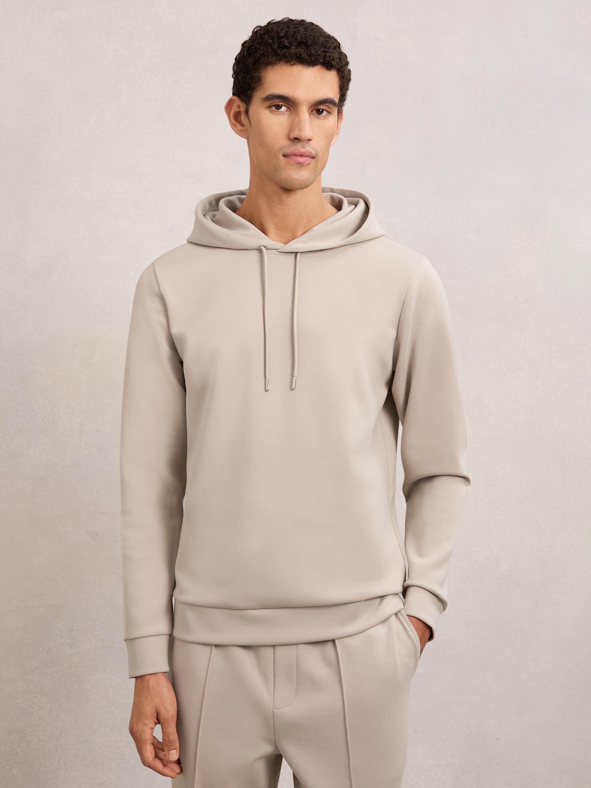 Product image 1 of 5, which shows Reiss Fabien Long Sleeve Interlock Hoodie, Stone, XS