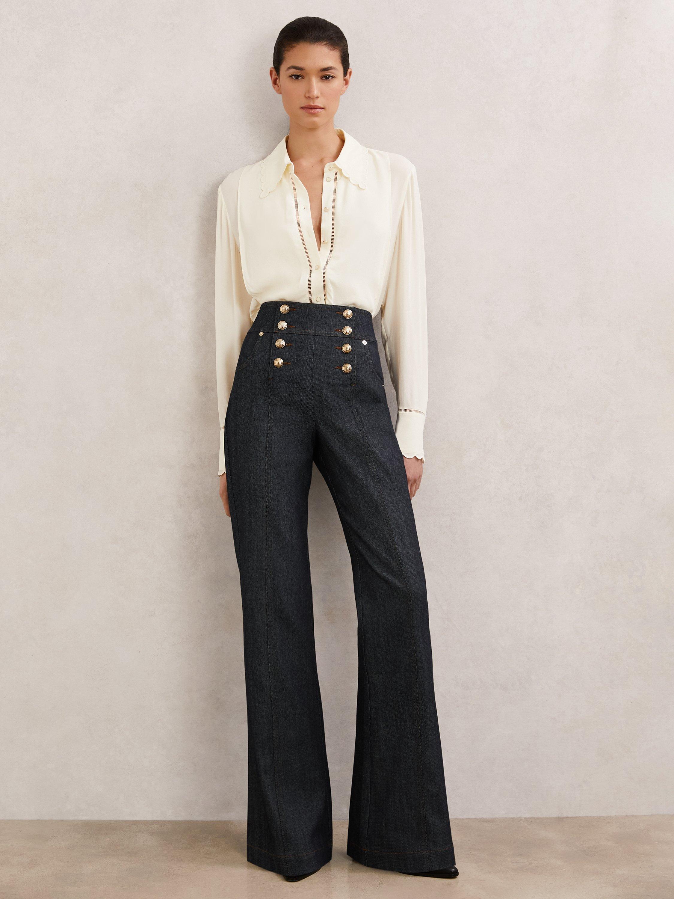 Product image 1 of 5, which shows Reiss Petite Skylar Button Detail Flared Jeans, Dark Blue, 6Pt
