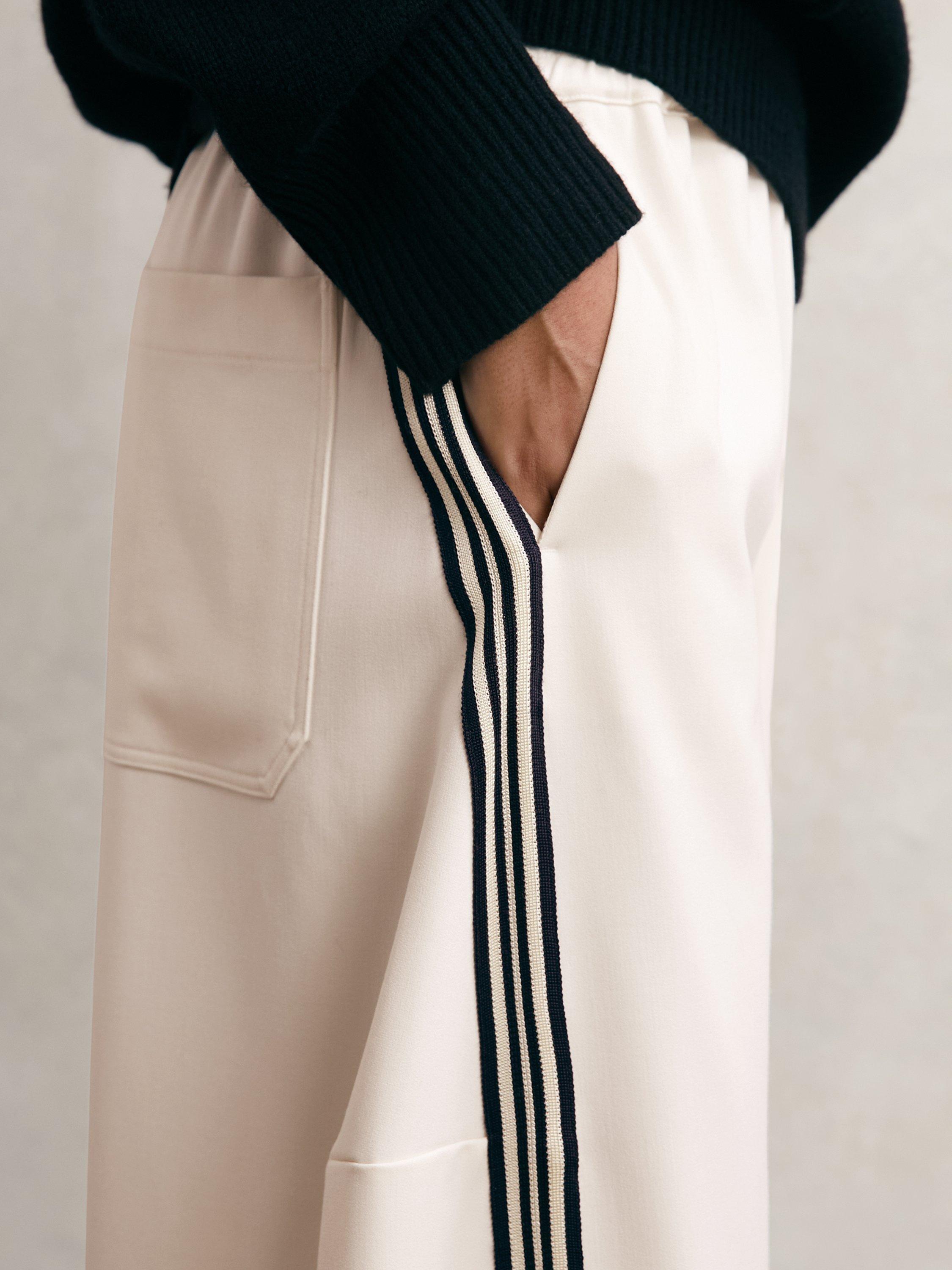 Product image 2 of 5, which shows Reiss Petite Elle Side Stripe Trousers, Cream, 6Pt