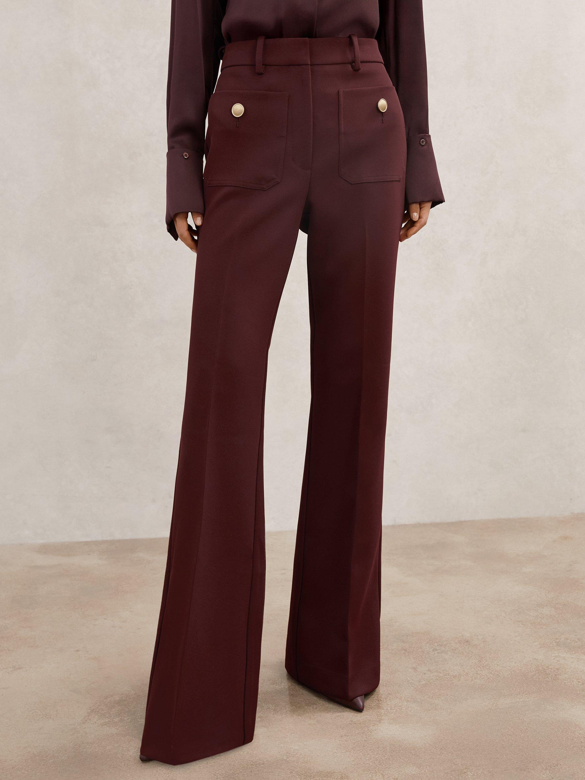 Product image 1 of 5, which shows Reiss Petite Parisa Button Pocket Flared Trousers, Dark Red, 6Pt