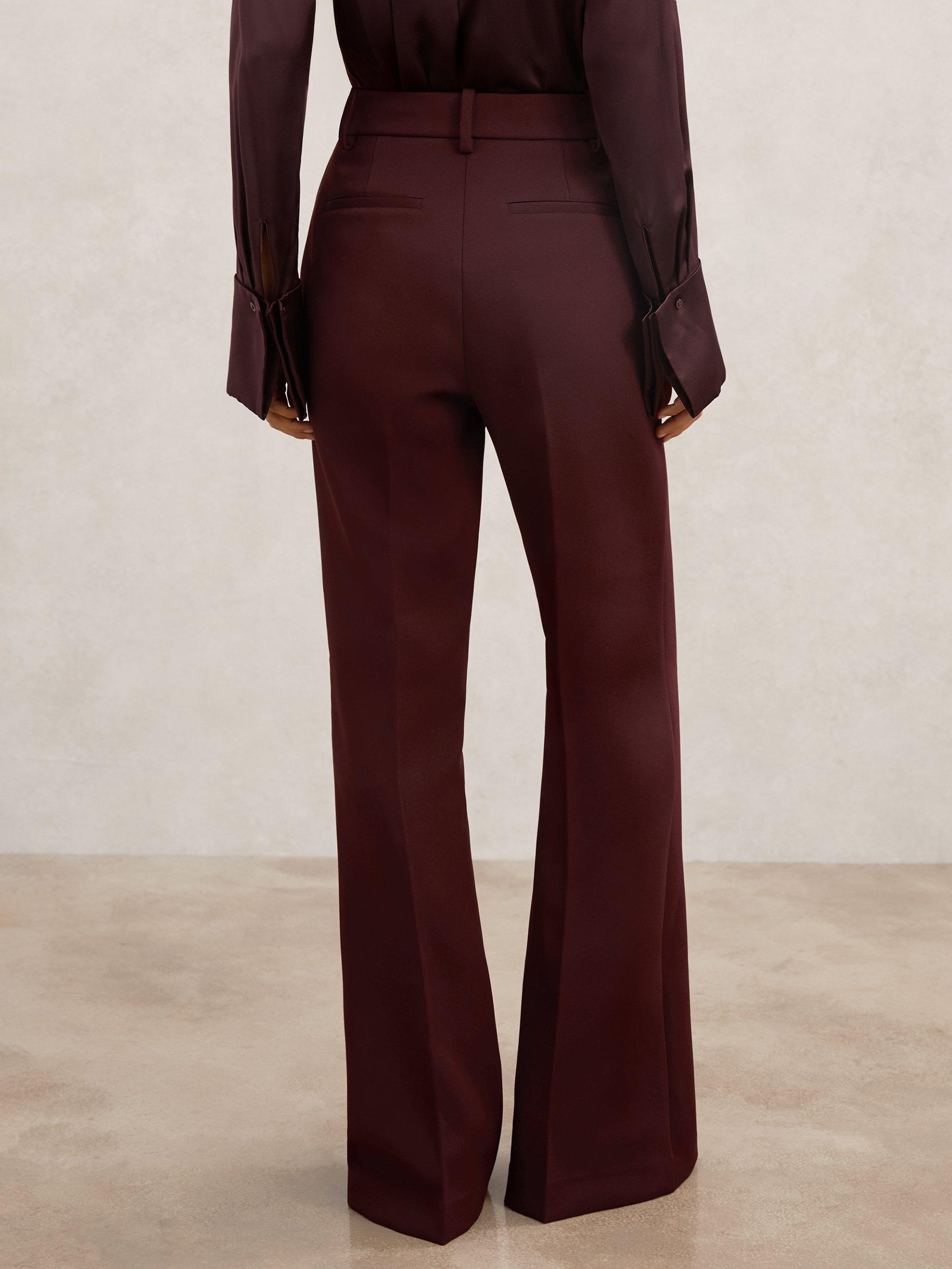 Product image 2 of 5, which shows Reiss Petite Parisa Button Pocket Flared Trousers, Dark Red, 6Pt