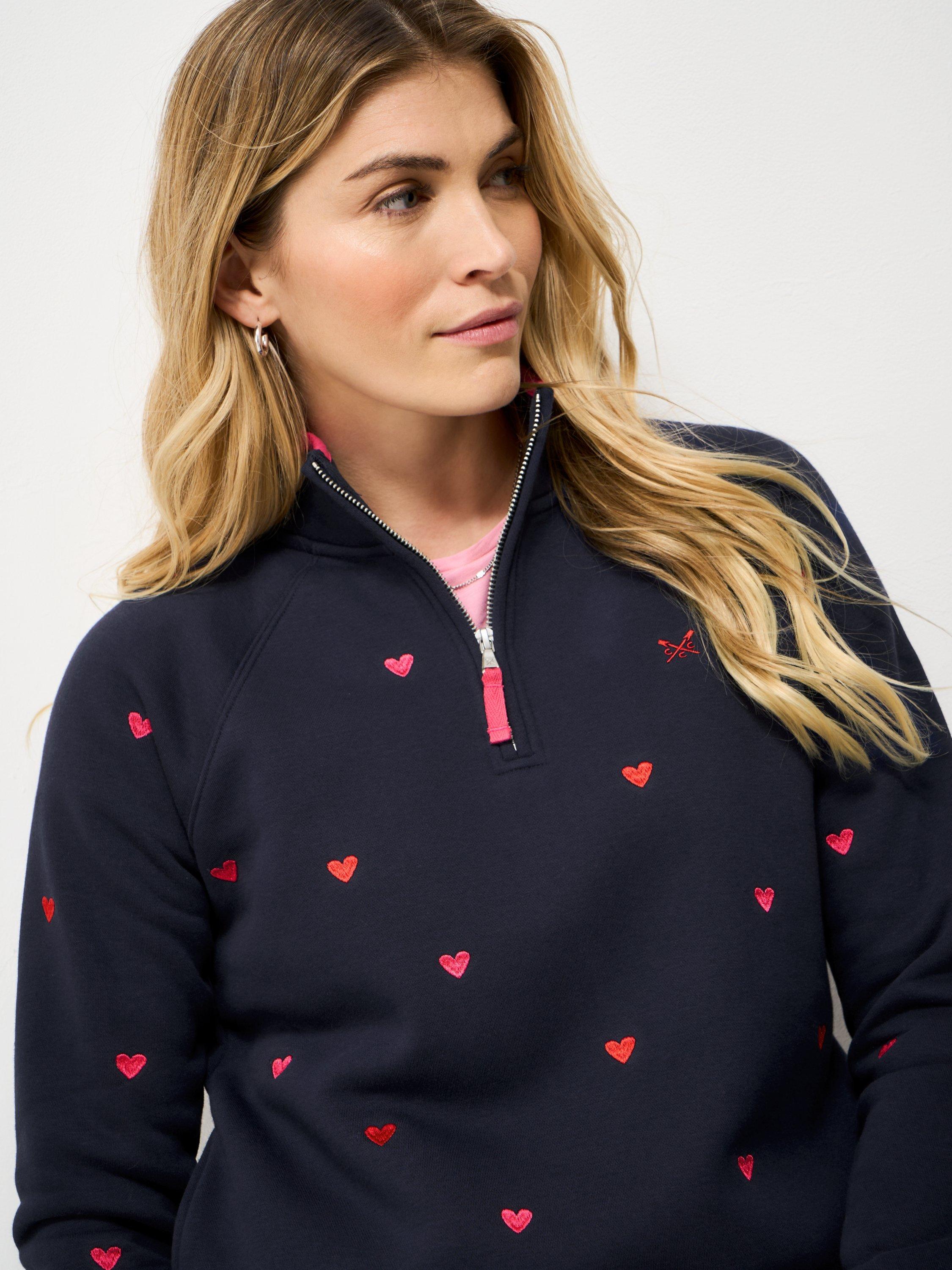 Product image 4 of 5, which shows Crew Clothing Embroidered Hearts Half Zip Sweatshirt, Navy Blue, 10