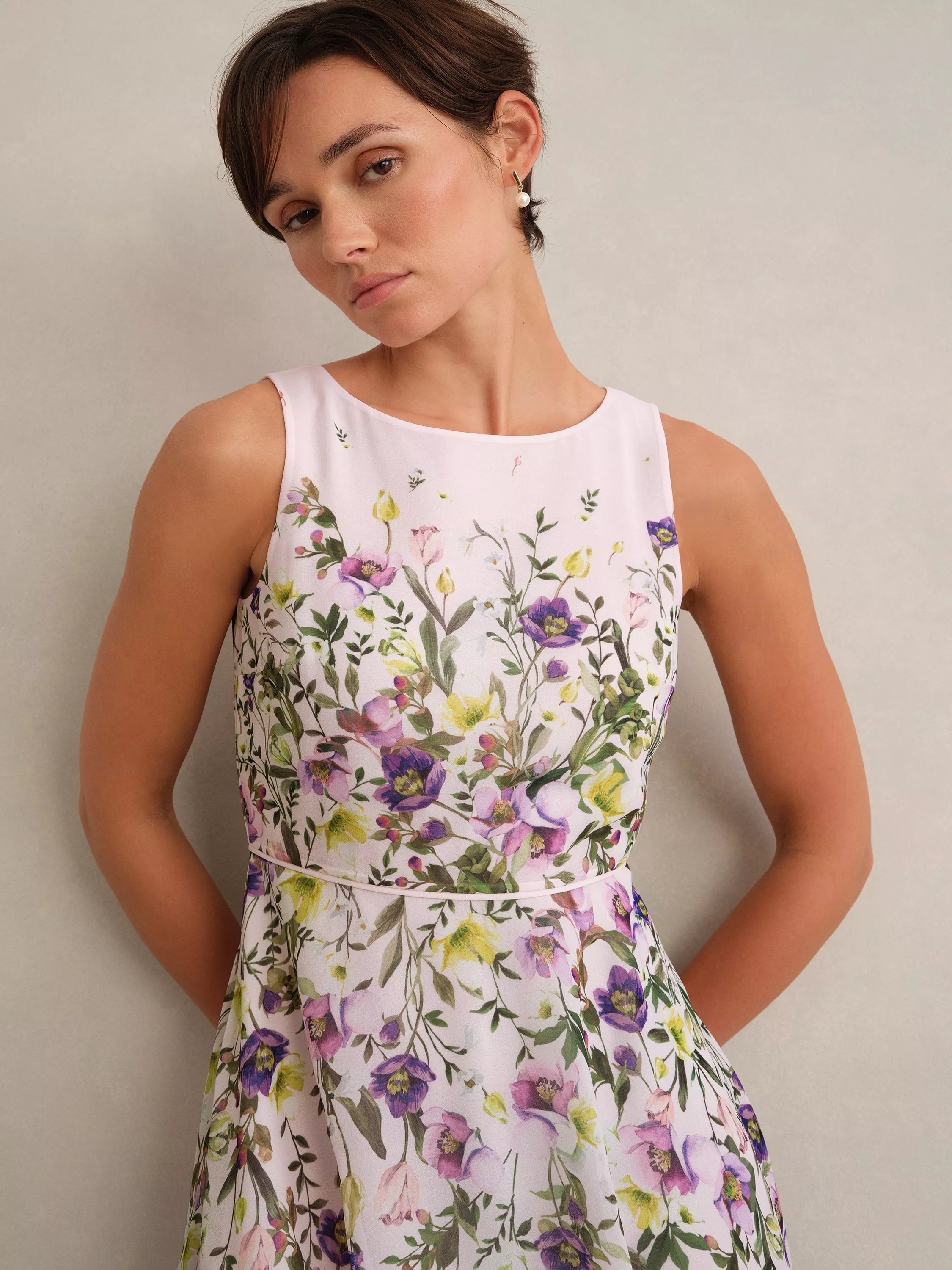 woman wearing a multicolour floral occasion dress