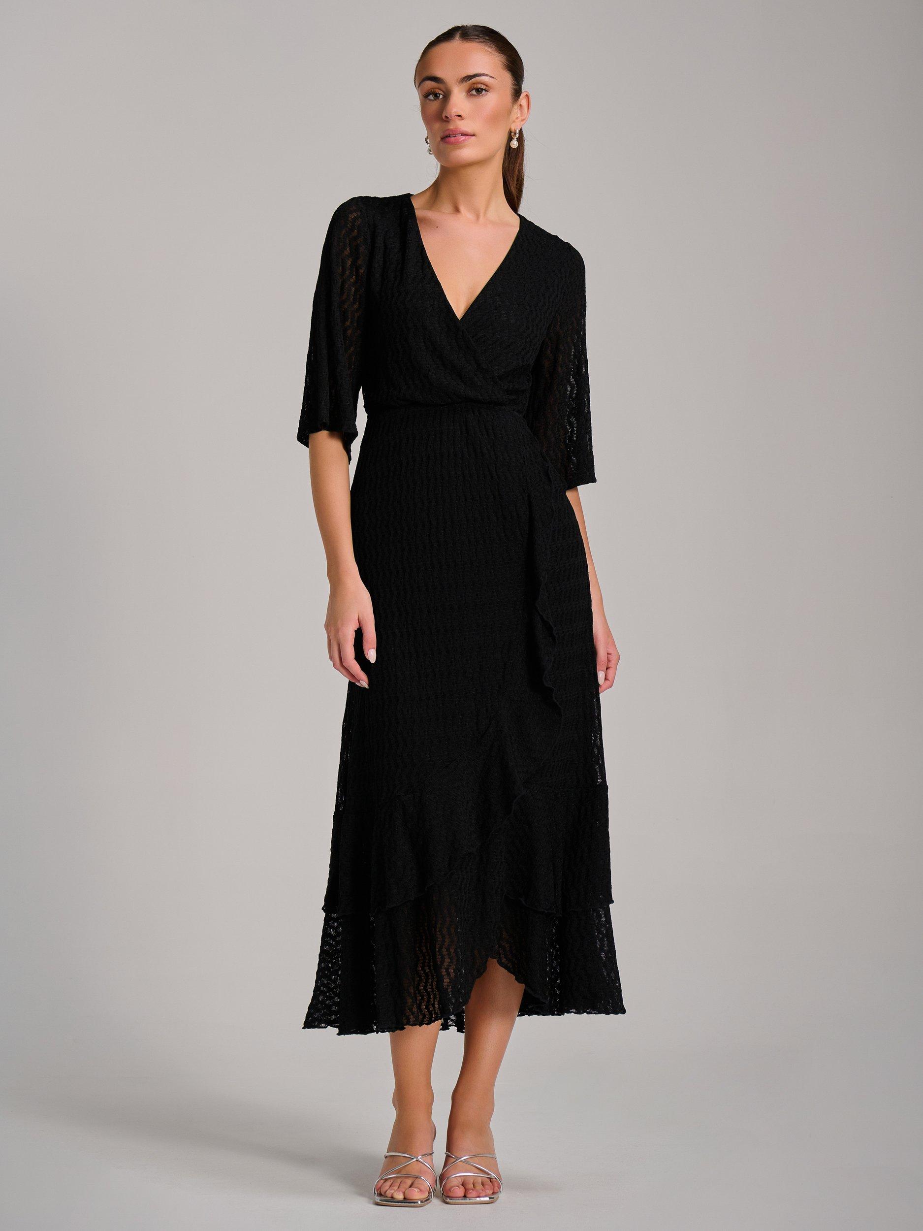 Product image 1 of 7, which shows Jolie Moi Ruffle Hem Knitted Maxi Dress, Black, 8